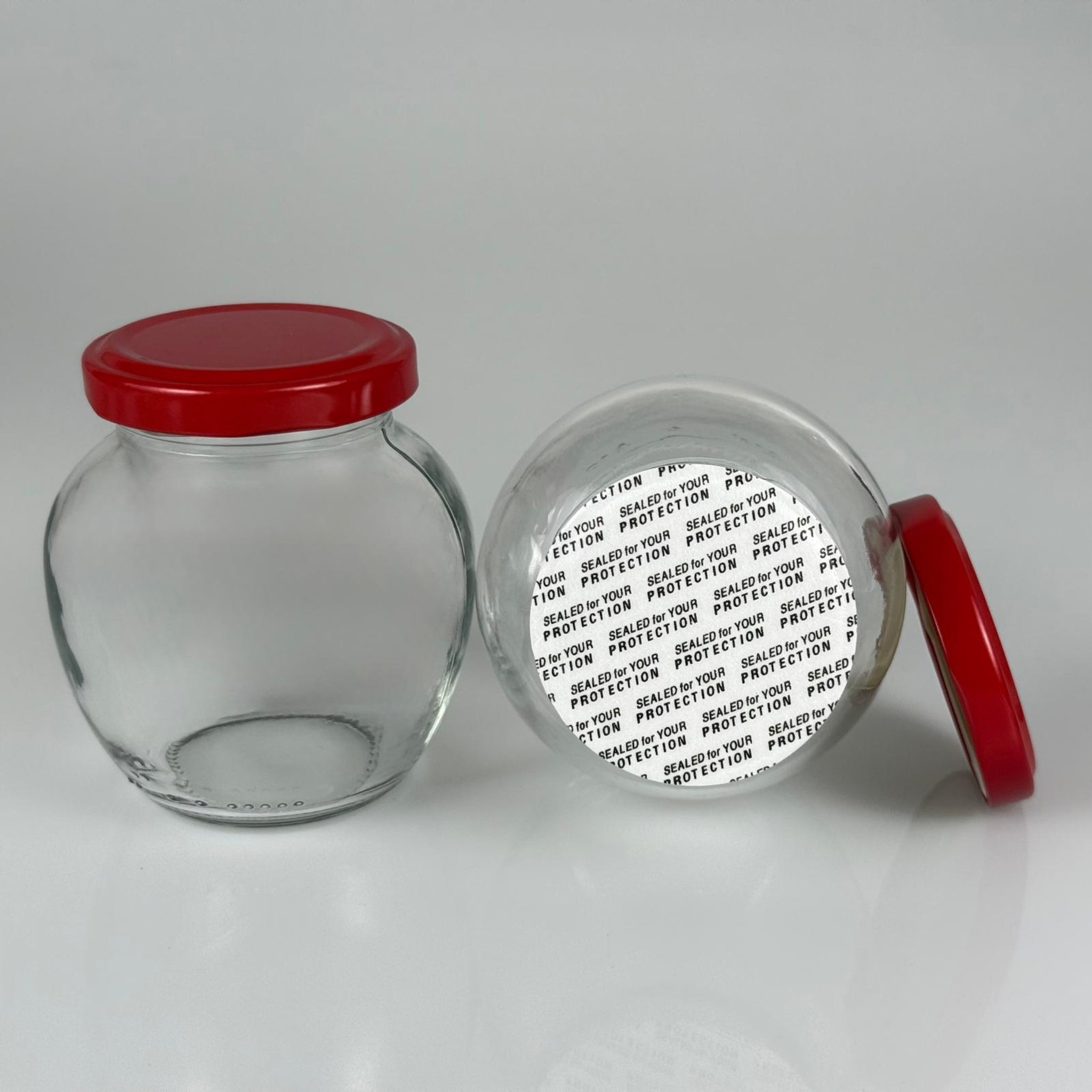 210 CC YUMURTA KAVANOZ + KIRMIZI METAL KAPAKLI + KENDİNDEN YAPIŞKANLI KÖPÜK CONTALI TAKIM - 210 ML OVAL TİP CAM KAVANOZ