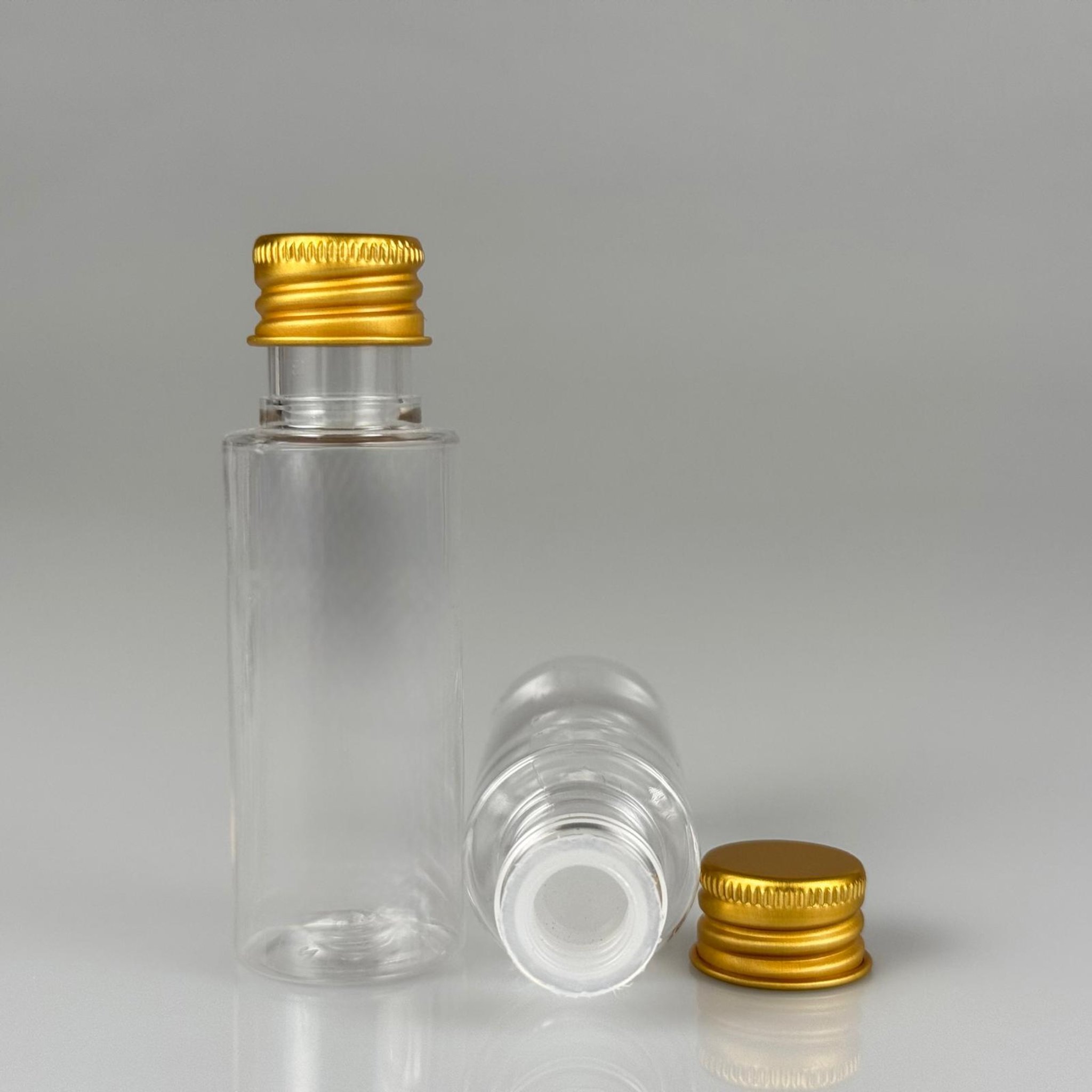 30 CC ŞEFFAF SİLİNDİR UZUN MODEL PET ŞİŞE + KÖPÜK CONTALI GOLD ALÜMİNYUM METAL KAPAKLI + KÖR TIPALI TAKIM - 30 ML PLASTİK ŞİŞE