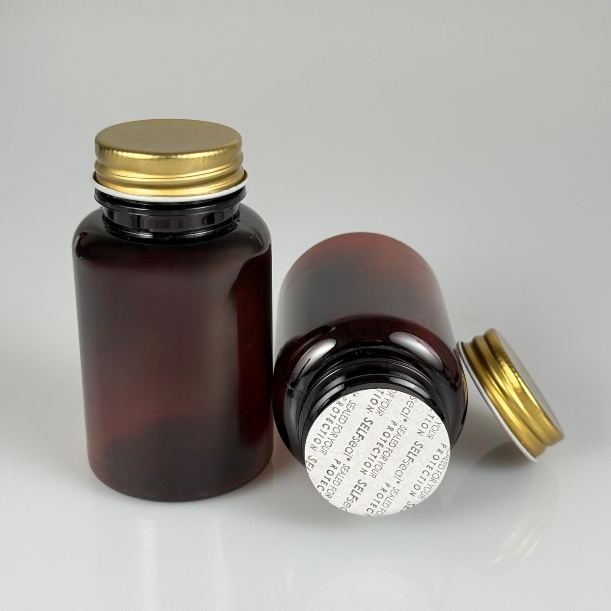 150 CC AMBER PET TABLET ŞİŞESİ - GOLD METAL KAPAKLI + KÖPÜK CONTALI 150 ML KAPSÜL KUTUSU - İLAÇ ŞİŞESİ - MEDİKAL HAP ŞİŞESİ - FARMASÖTİK KAVANOZ
