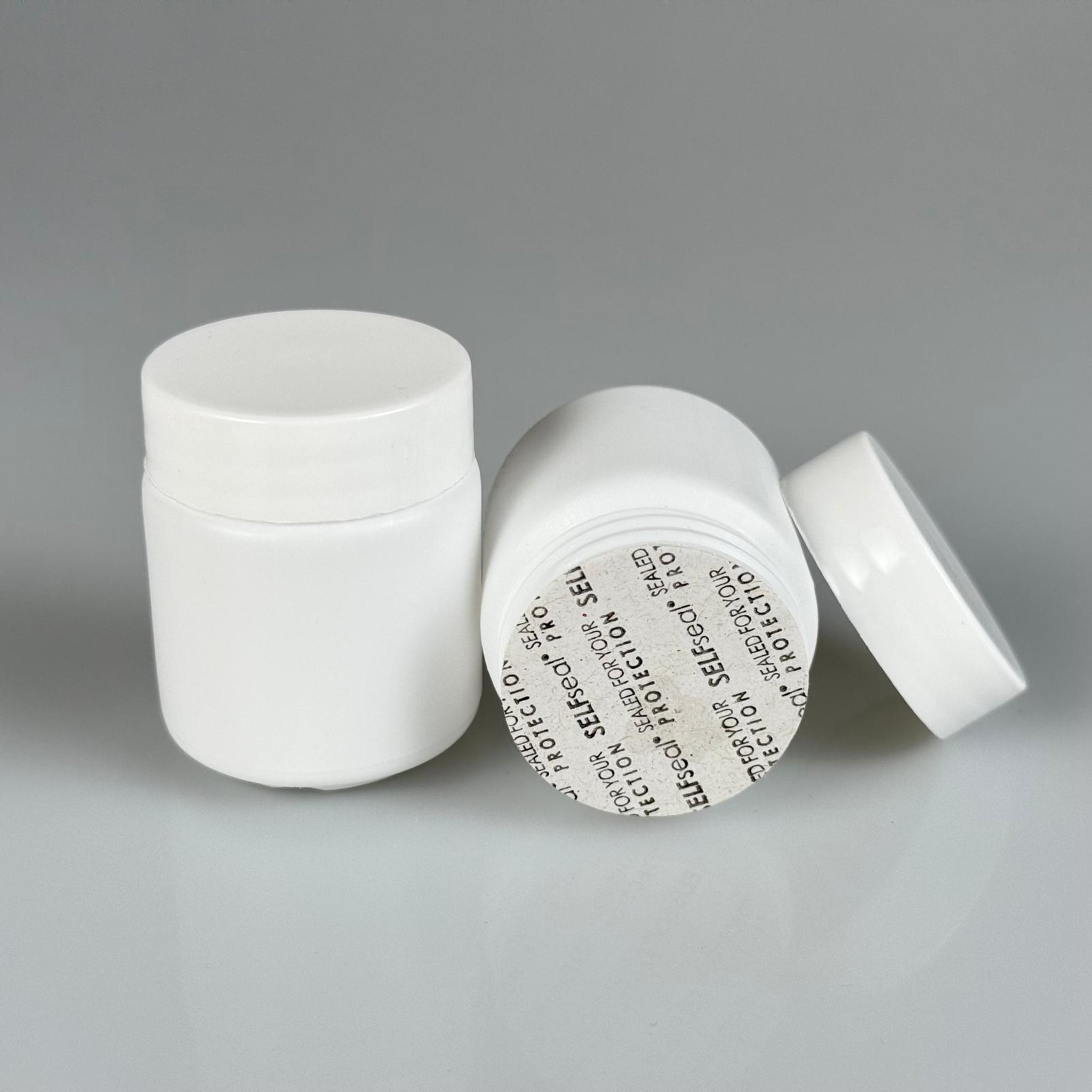 50 CC BEYAZ SERT POLİETİLEN ŞİŞE + BEYAZ PLASTİK KAPAKLI + KENDİNDEN YAPIŞKANLI KÖPÜK CONTALI - 50 ML POLİETİLEN ŞİŞE