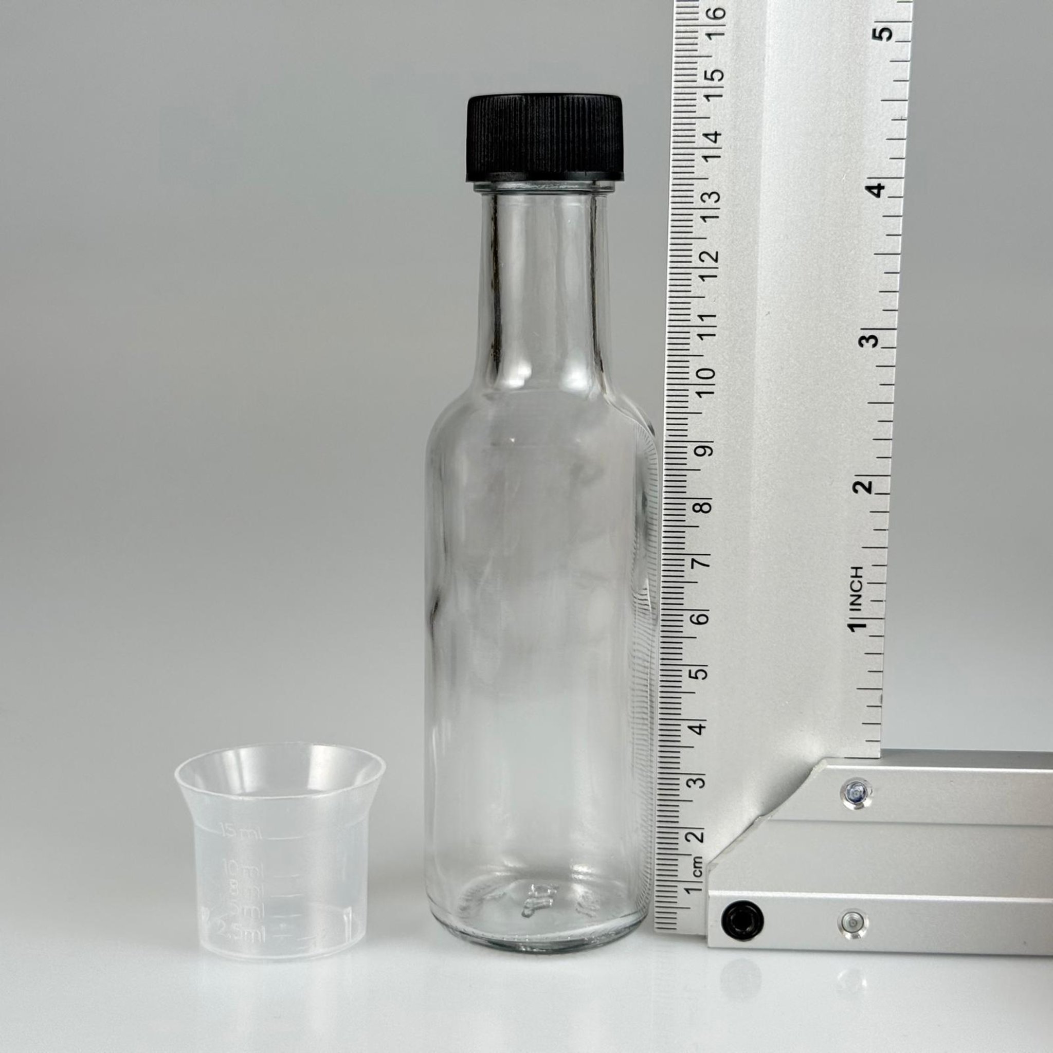 100 CC DORİKA CAM ŞİŞE + SİYAH CONTALI KAPAK + 15 ML ÖLÇEK TAKIM - 100 ML ŞEFFAF CAM DORİKA ŞİŞE