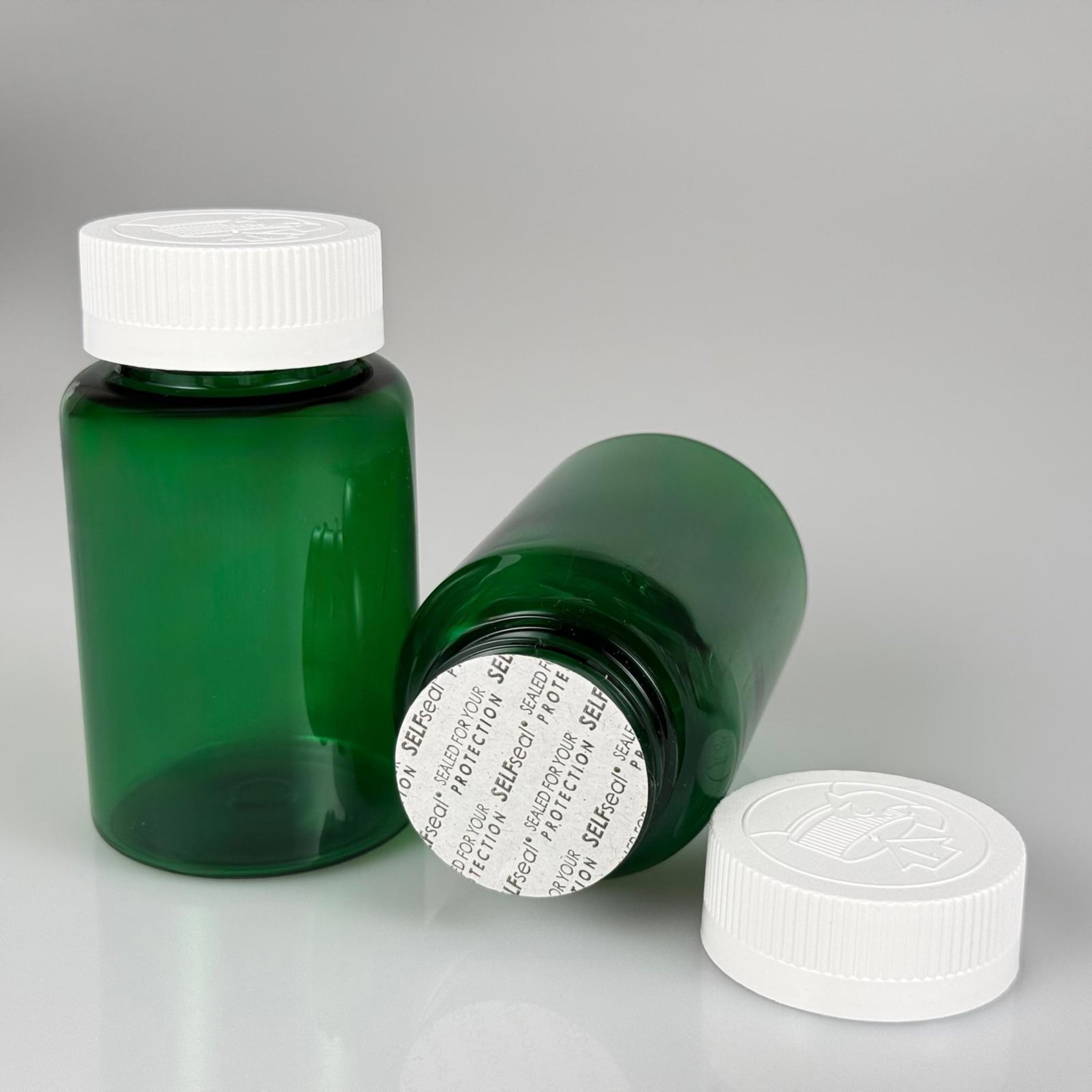 150 ML CONTALI ÇOCUK KİLİT KAPAKLI TABLET ŞİŞESİ  - 150 CC YEŞİL PET KAVANOZ + 38 MM BEYAZ ÇOCUK KİLİTLİ KAPAK + KENDİNDEN YAPIŞKANLI KÖPÜK CONTA TAKIM -  KAPSÜL KUTUSU - İLAÇ ŞİŞESİ - MEDİKAL HAP ŞİŞESİ - FARMASÖTİK KAVANOZ