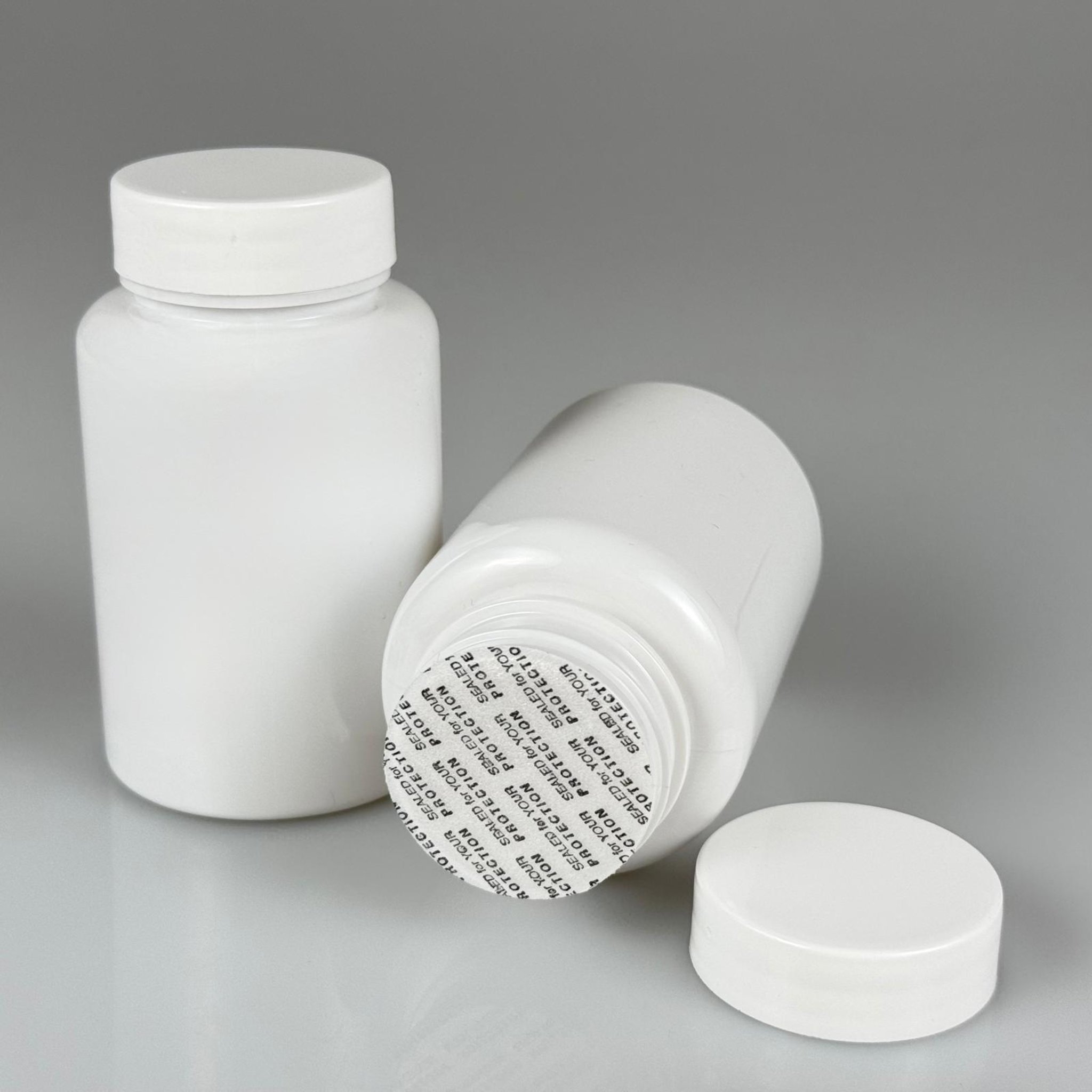 150 CC BEYAZ PET TABLET ŞİŞESİ - BEYAZ KAPAKLI + KENDİNDEN YAPIŞKANLI KÖPÜK CONTALI - 150 ML KAPSÜL KUTUSU - İLAÇ ŞİŞESİ - MEDİKAL HAP ŞİŞESİ - FARMASÖTİK KAVANOZ