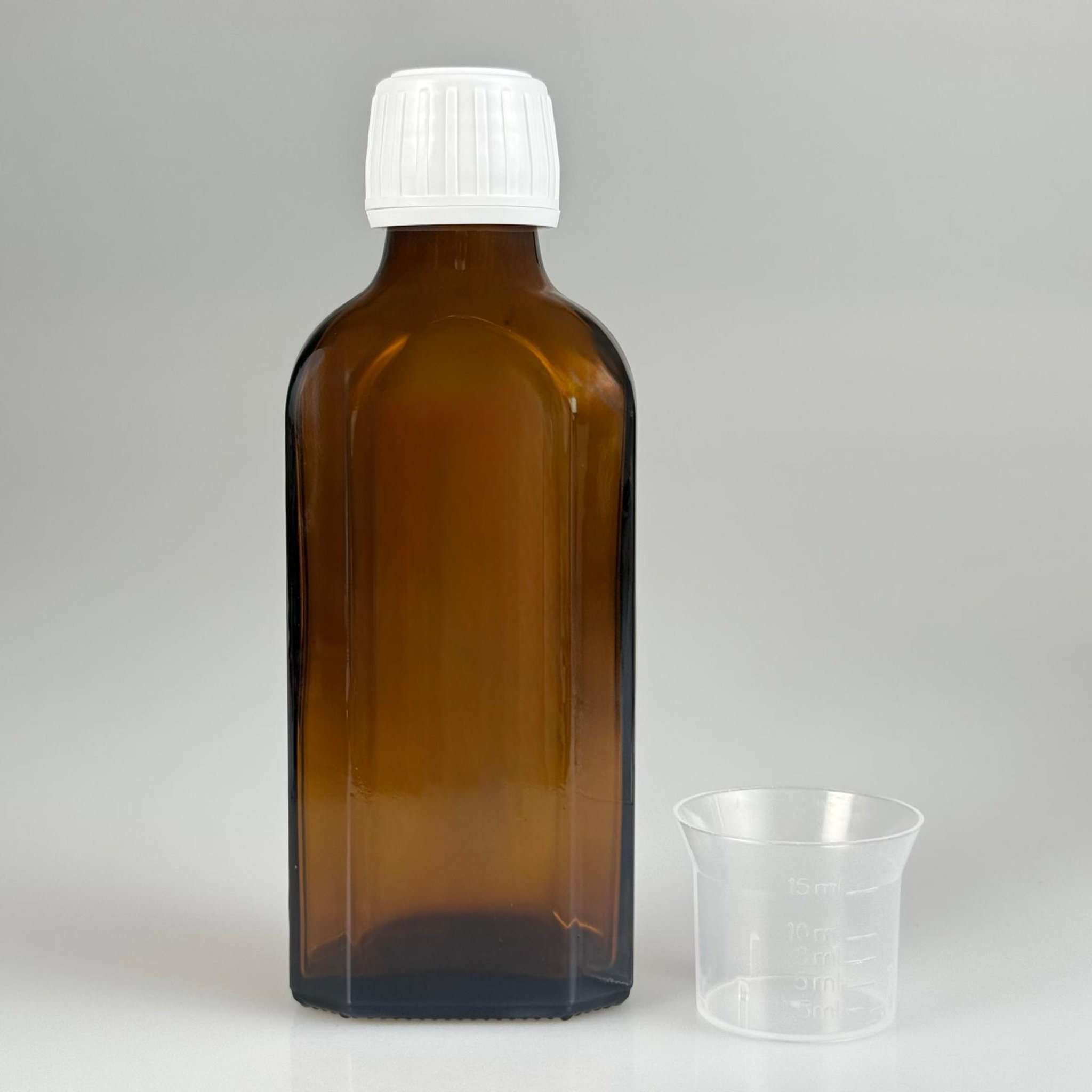 100 CC AMBER YASSI CAM ŞİŞE + BEYAZ KİLİTLİ ECZA KAPAK + 15 ML ÖLÇEK TAKIM 100 ML KAHVERENGİ YASSI MODEL CAM ŞİŞE