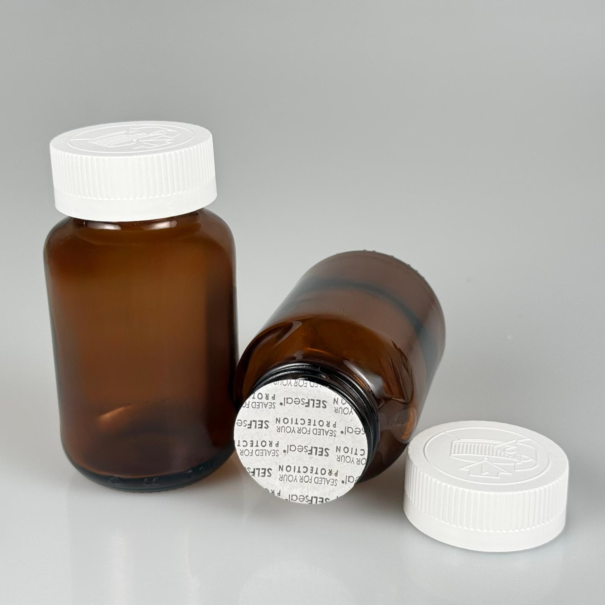 120 CC AMBER CAM TABLET ŞİŞESİ + 38 BEYAZ ÇOCUK KİLİTLİ KAPAK + KÖPÜK CONTALI TAKIM - 120 ML (SİLME 133 ML) KAPSÜL KUTUSU - İLAÇ ŞİŞESİ - MEDİKAL HAP ŞİŞESİ - FARMASÖTİK KAVANOZ