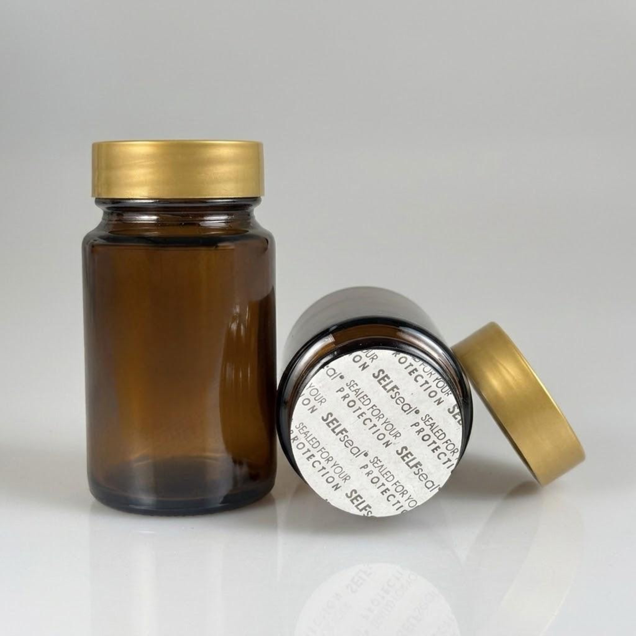 75 CC AMBER CAM TABLET ŞİŞESİ + GOLD PLASTİK KAPAKLI + KENDİNDEN YAPIŞKANLI KÖPÜK CONTALI TAKIM - 75 ML KAPSÜL ŞİŞESİ - GENİŞ AĞIZLI İLAÇ ŞİŞESİ - TABLET KAVANOZU