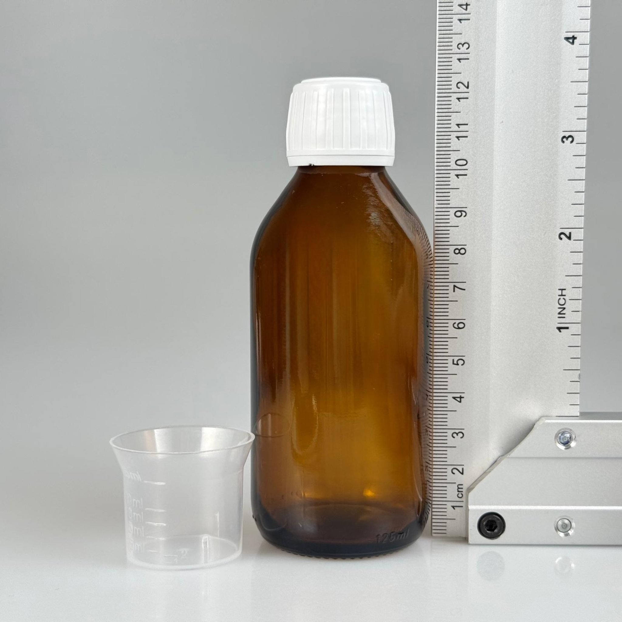 125 CC AMBER CAM ŞİŞE + BEYAZ KİLİTLİ KAPAKLI + 15 ML ÖLÇEK TAKIM - 125 ML KAHVERENGİ BOŞ ŞURUP ŞİŞESİ (AĞIZ ÇAPI 25 MM)