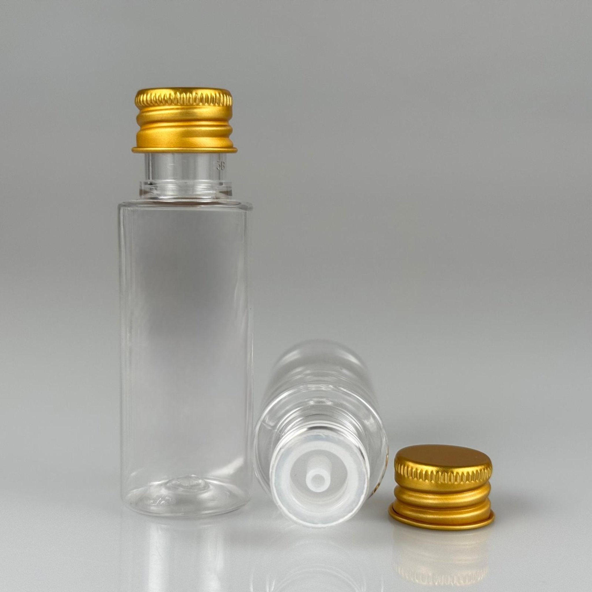 30 CC ŞEFFAF SİLİNDİR UZUN MODEL PET ŞİŞE + KÖPÜK CONTALI GOLD ALÜMİNYUM METAL KAPAKLI + DAMLALIKLI KOLONYA TIPALI TAKIM - 30 ML PLASTİK ŞİŞE