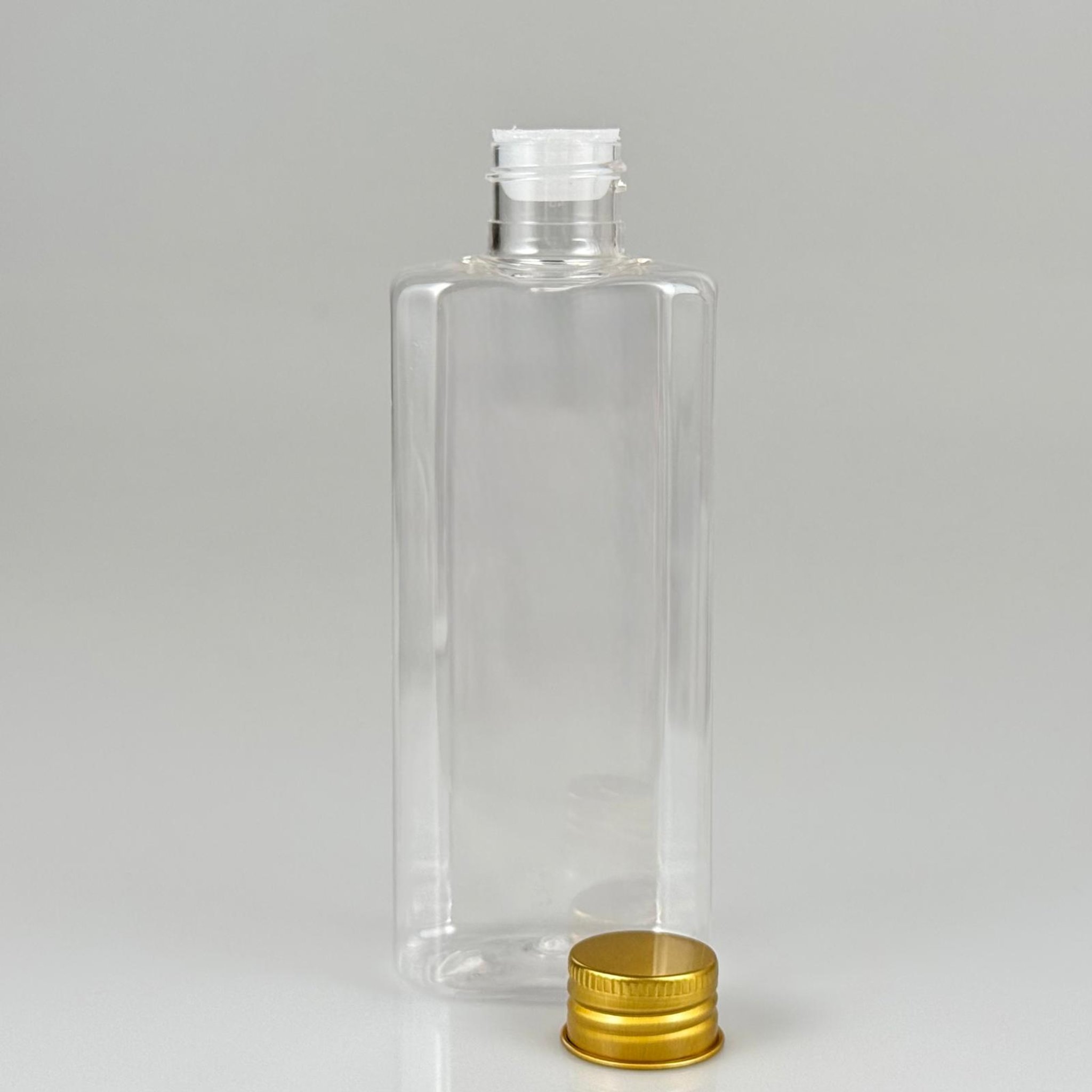 200 CC YASSI MODEL ŞEFFAF PET ŞİŞE (24 AĞIZ) + KÖPÜK CONTALI GOLD METAL ALÜMİNYUM KAPAK + KOLONYA TIPALI TAKIM - 200 ML KAPAKLI PLASTİK ŞİŞELER