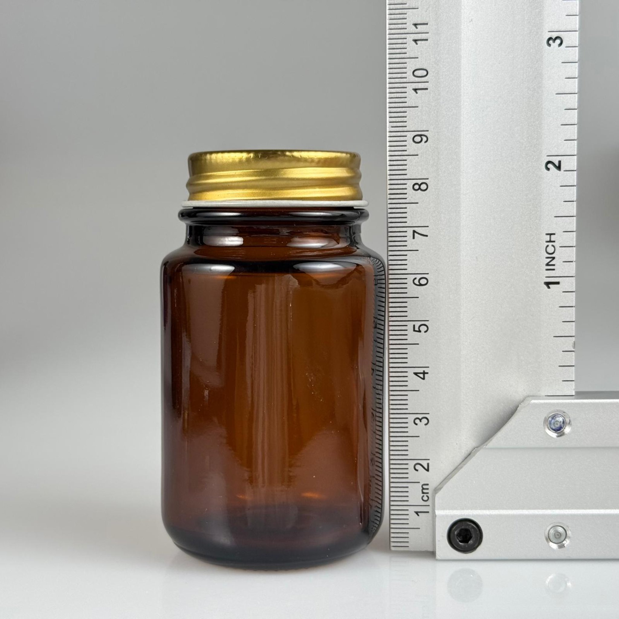 95 CC AMBER CAM TABLET ŞİŞESİ - GOLD METAL KAPAKLI - 95 ML KAPSÜL ŞİŞESİ - GENİŞ AĞIZLI İLAÇ ŞİŞESİ - TABLET KAVANOZU - ŞİŞECAM KODU 763910