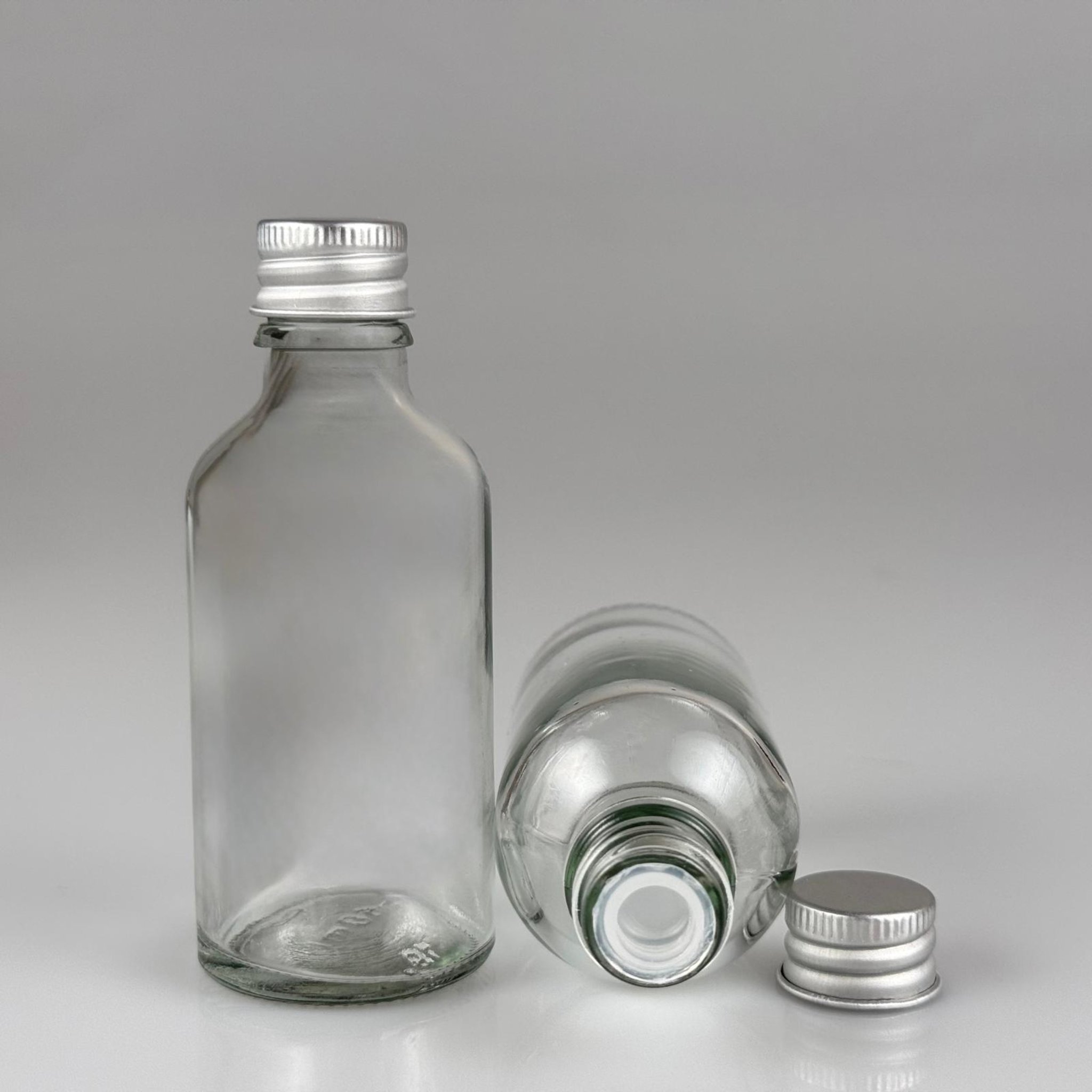 50 CC ŞEFFAF CAM ŞİŞE + KÖPÜK CONTALI GÜMÜŞ ALÜMİNYUM METAL KAPAKLI + KÖR TIPALI TAKIM - 50 ML ŞEFFAF CAM ŞİŞE
