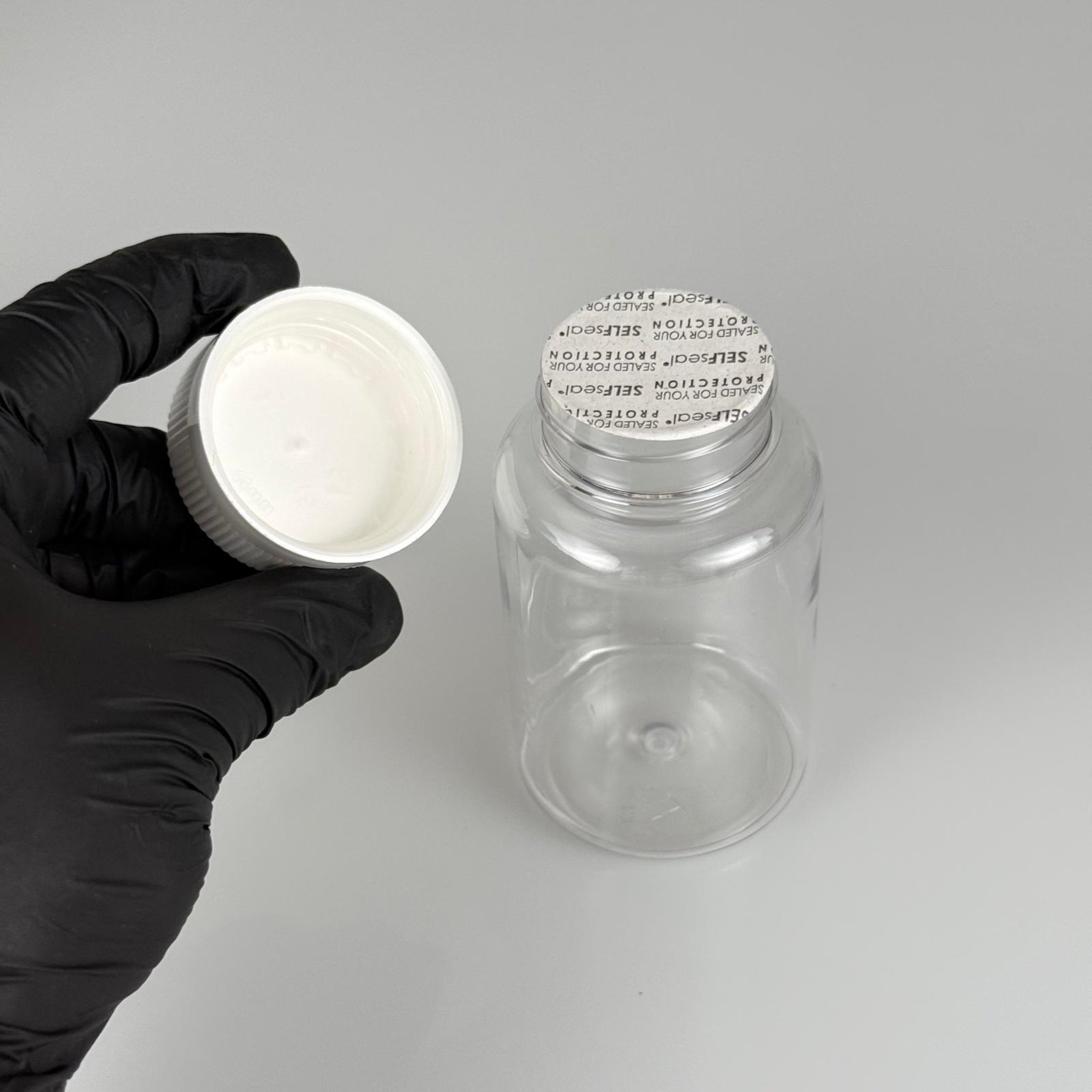 150 ML CONTALI ÇOCUK KİLİT KAPAKLI TABLET ŞİŞESİ  - 150 CC ŞEFFAF PET KAVANOZ + 38 MM BEYAZ ÇOCUK KİLİTLİ KAPAK + KENDİNDEN YAPIŞKANLI KÖPÜK CONTA TAKIM -  KAPSÜL KUTUSU - İLAÇ ŞİŞESİ - MEDİKAL HAP ŞİŞESİ - FARMASÖTİK KAVANOZ