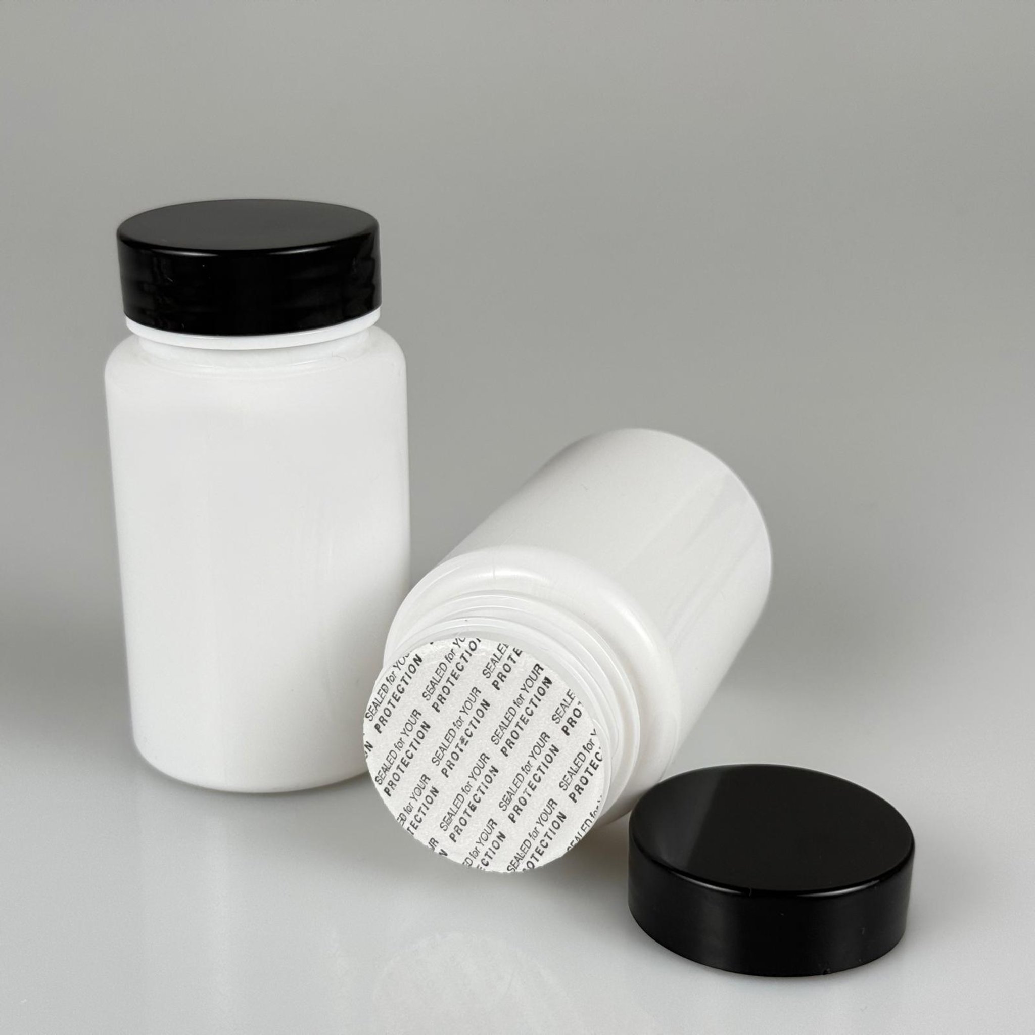 100 CC BEYAZ PET TABLET ŞİŞESİ - SİYAH KAPAKLI + KENDİNDEN YAPIŞKANLI KÖPÜK CONTALI - 100 ML KAPSÜL KUTUSU - İLAÇ ŞİŞESİ - MEDİKAL HAP ŞİŞESİ - FARMASÖTİK KAVANOZ