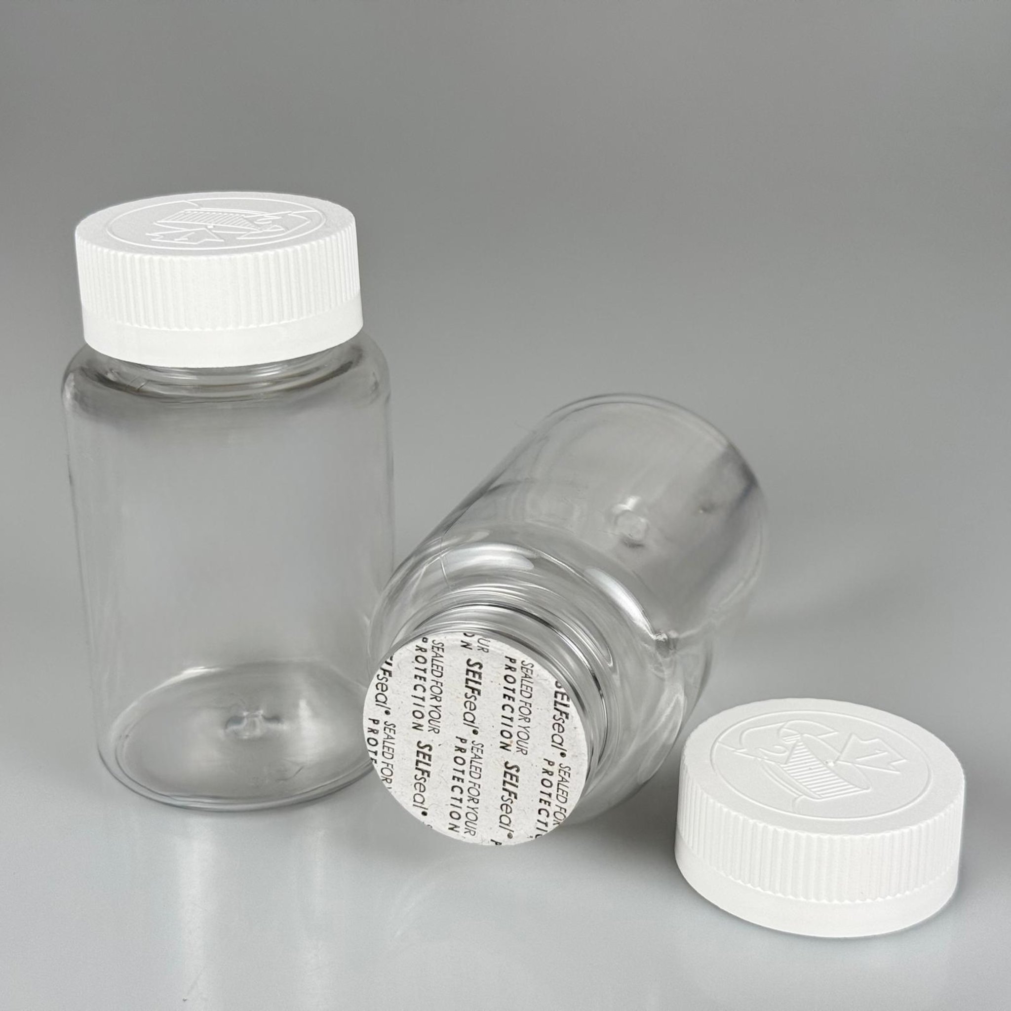 150 ML CONTALI ÇOCUK KİLİT KAPAKLI TABLET ŞİŞESİ  - 150 CC ŞEFFAF PET KAVANOZ + 38 MM BEYAZ ÇOCUK KİLİTLİ KAPAK + KENDİNDEN YAPIŞKANLI KÖPÜK CONTA TAKIM -  KAPSÜL KUTUSU - İLAÇ ŞİŞESİ - MEDİKAL HAP ŞİŞESİ - FARMASÖTİK KAVANOZ