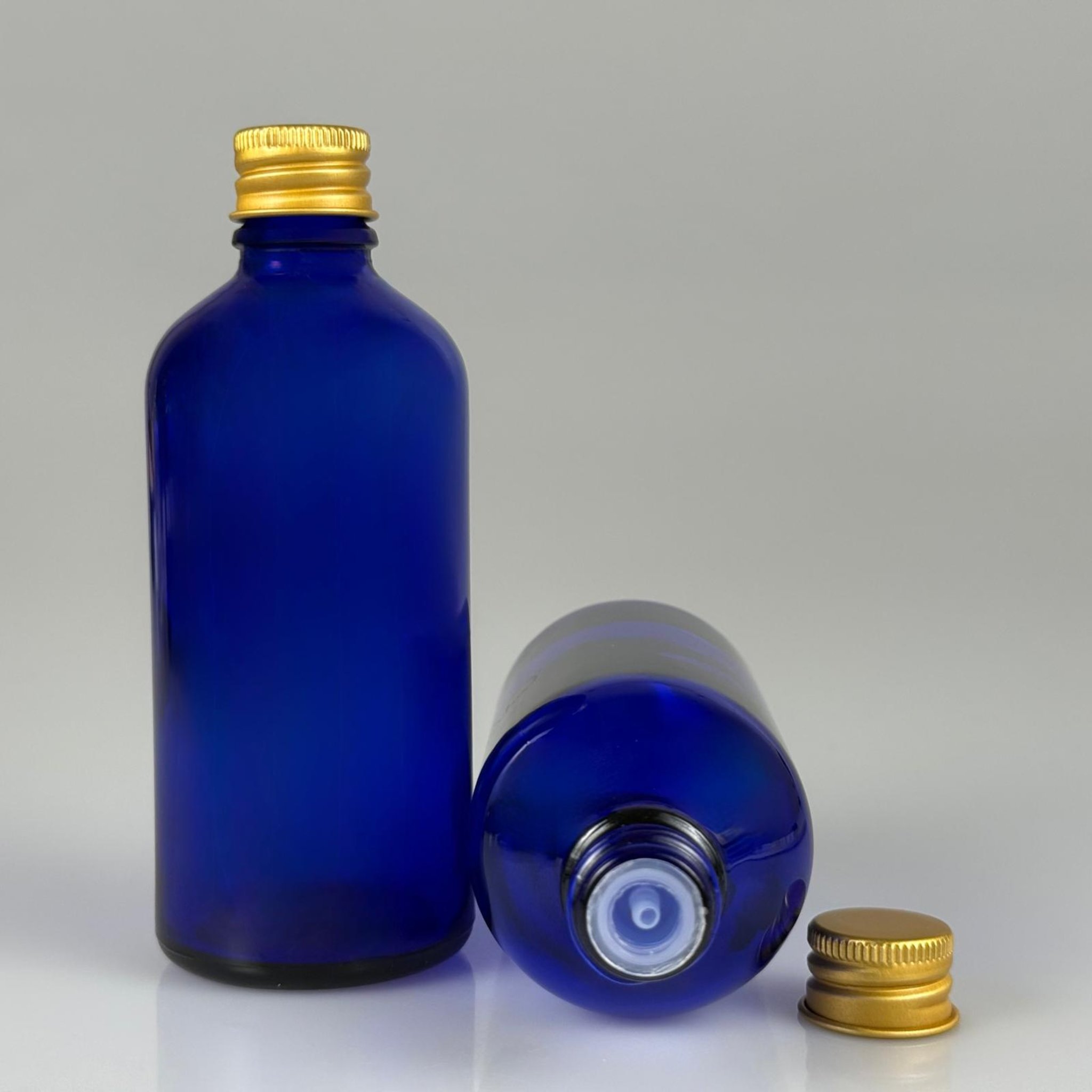 100 CC MAVİ CAM ŞİŞE + KÖPÜK CONTALI GOLD ALÜMİNYUM METAL + KOLONYA TIPALI KAPAKLI TAKIM - 100 ML MAVİ CAM ŞİŞE
