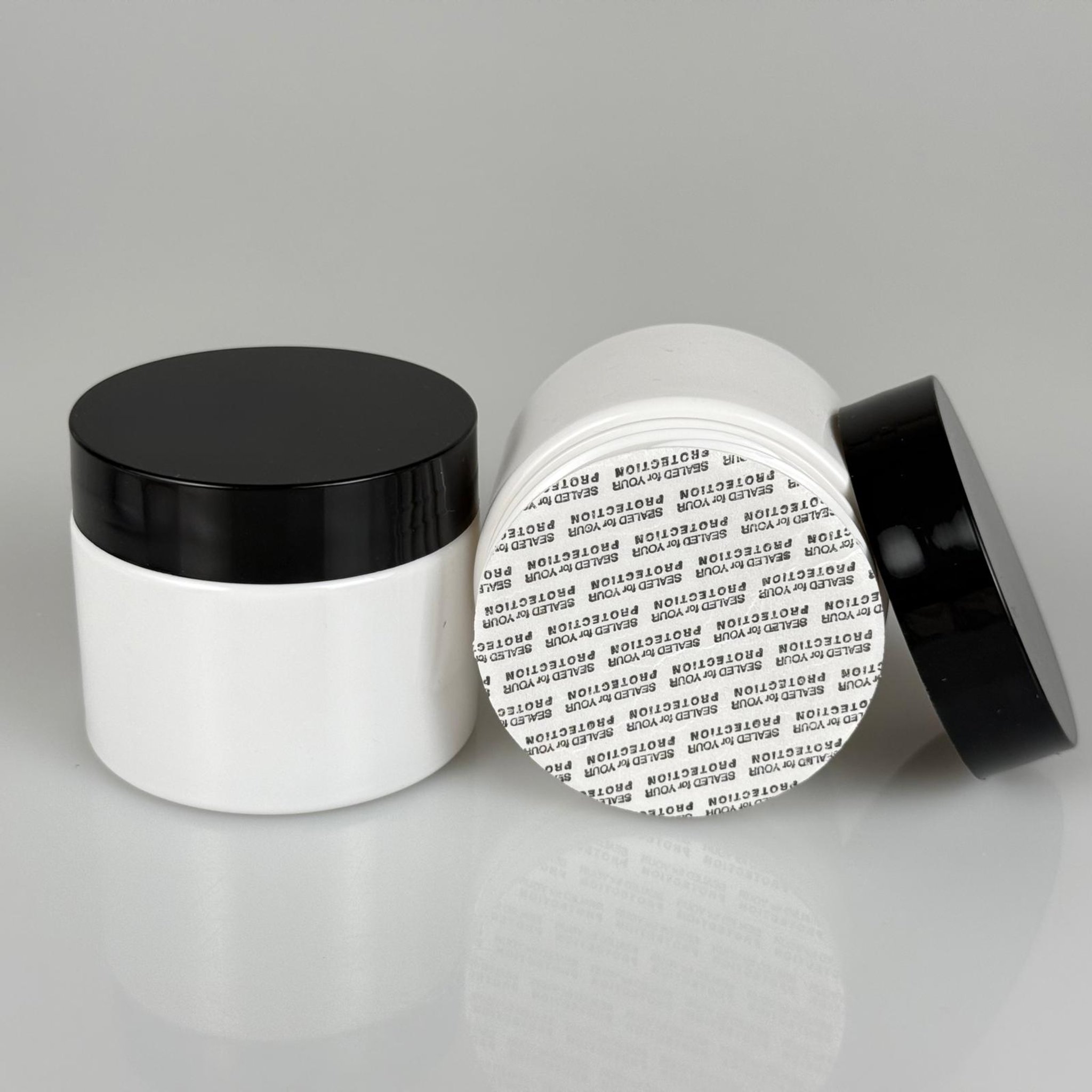 100 CC BEYAZ PET KAVANOZ + SİYAH PLASTİK KAPAKLI - KENDİNDEN YAPIŞKANLI KÖPÜK CONTALI TAKIM - 100 ML PLASTİK KREM KAVANOZU