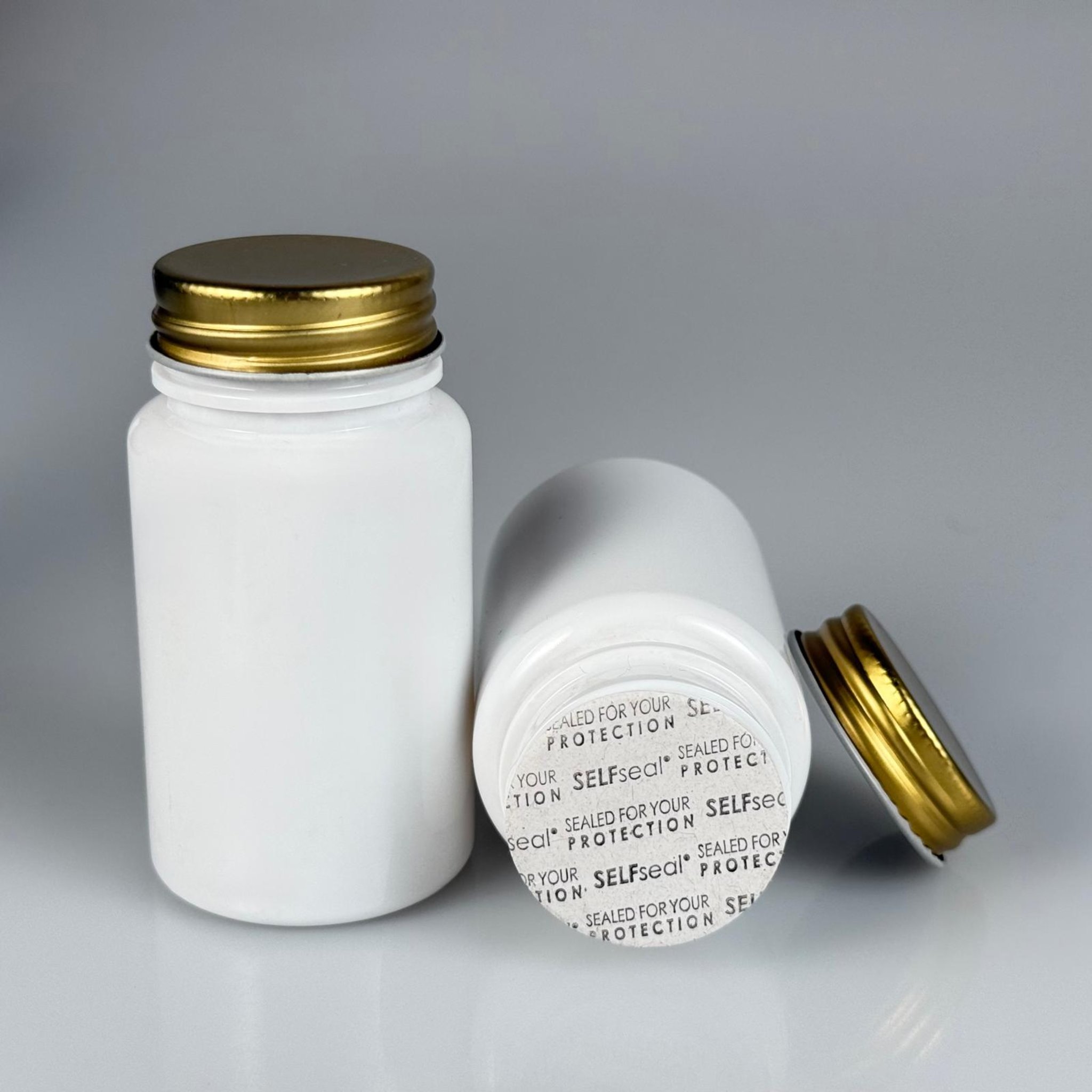 100 CC BEYAZ PET TABLET ŞİŞESİ - GOLD METAL KAPAKLI + KENDİNDEN YAPIŞKANLI KÖPÜK CONTALI - 100 ML KAPSÜL KUTUSU - İLAÇ ŞİŞESİ - MEDİKAL HAP ŞİŞESİ - FARMASÖTİK KAVANOZ