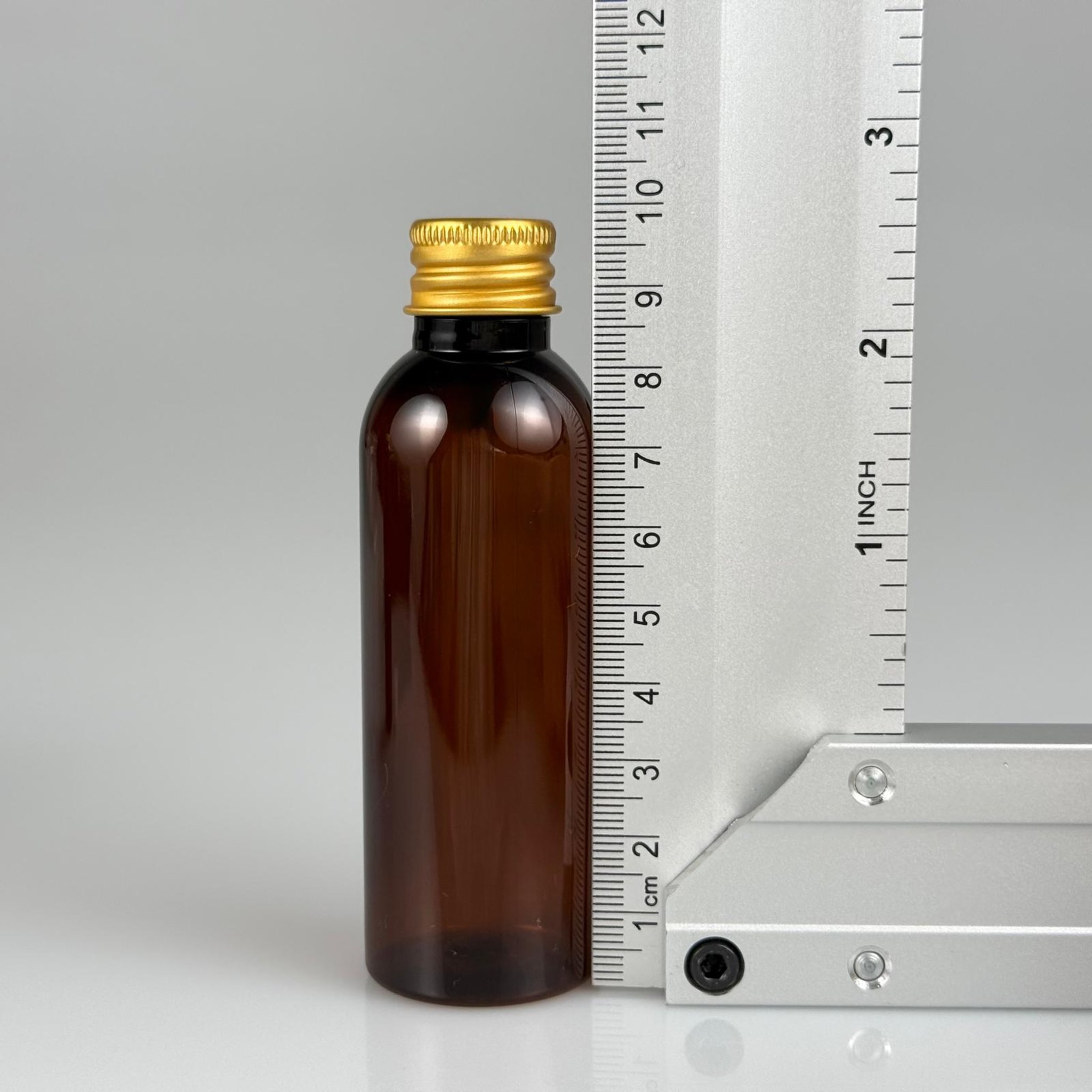 50 CC AMBER SİLİNDİR UZUN MODEL PET ŞİŞE + KÖPÜK CONTALI GOLD ALÜMİNYUM METAL KAPAKLI TAKIM - 50 ML KAHVERENGİ PLASTİK ŞİŞE