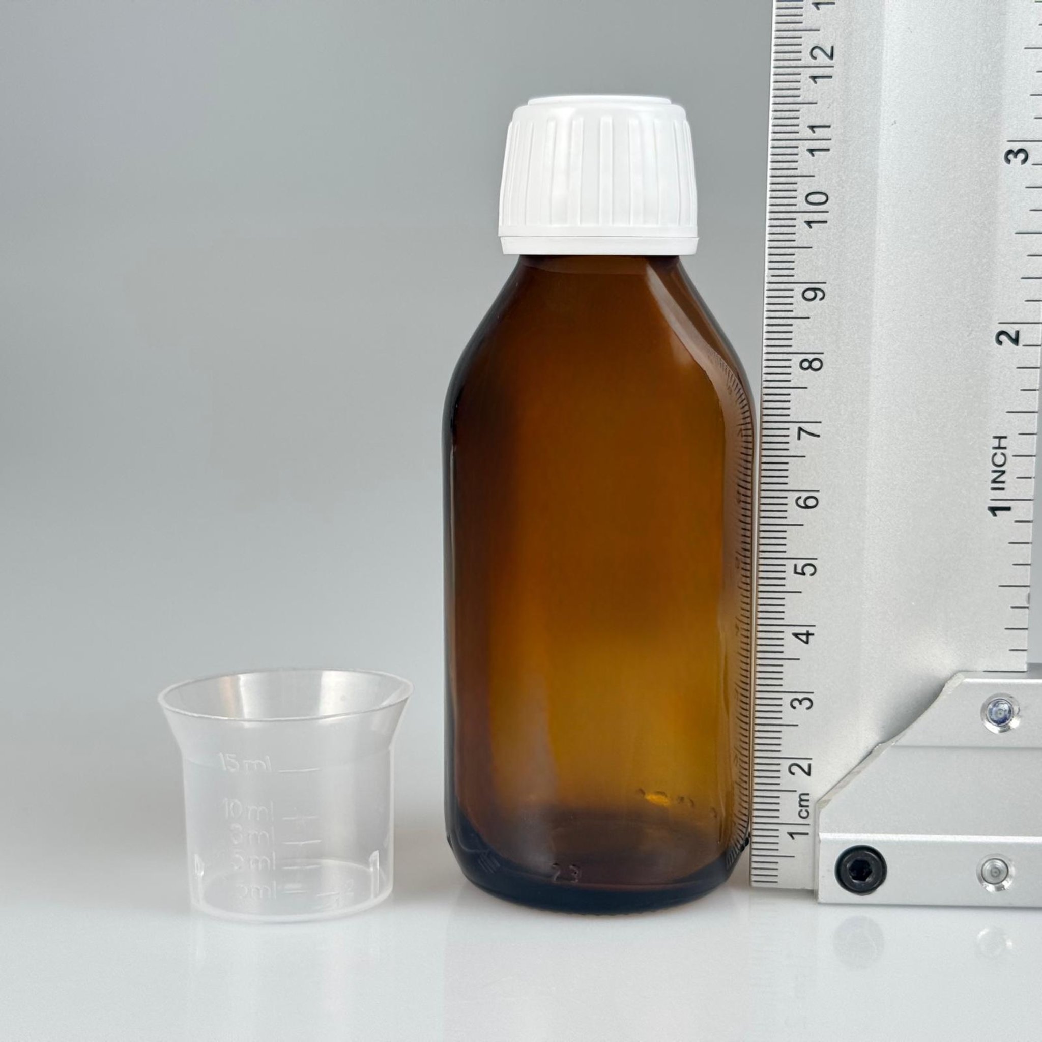 100 CC AMBER CAM ŞİŞE + BEYAZ KİLİTLİ KAPAKLI -+ 15 ML ÖLÇEK TAKIM - 100 ML KAHVERENGİ BOŞ ŞURUP ŞİŞESİ (AĞIZ ÇAPI 25 MM)