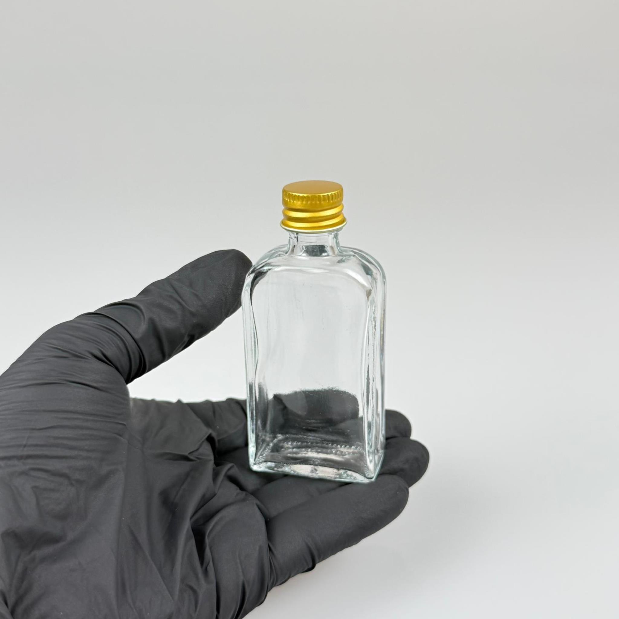 50 CC YASSI DİKDÖRTGEN CAM ŞİŞE - GOLD METAL KAPAKLI KOLONYA TIPALI - 50 ML PRESTİJLİ ŞİŞE