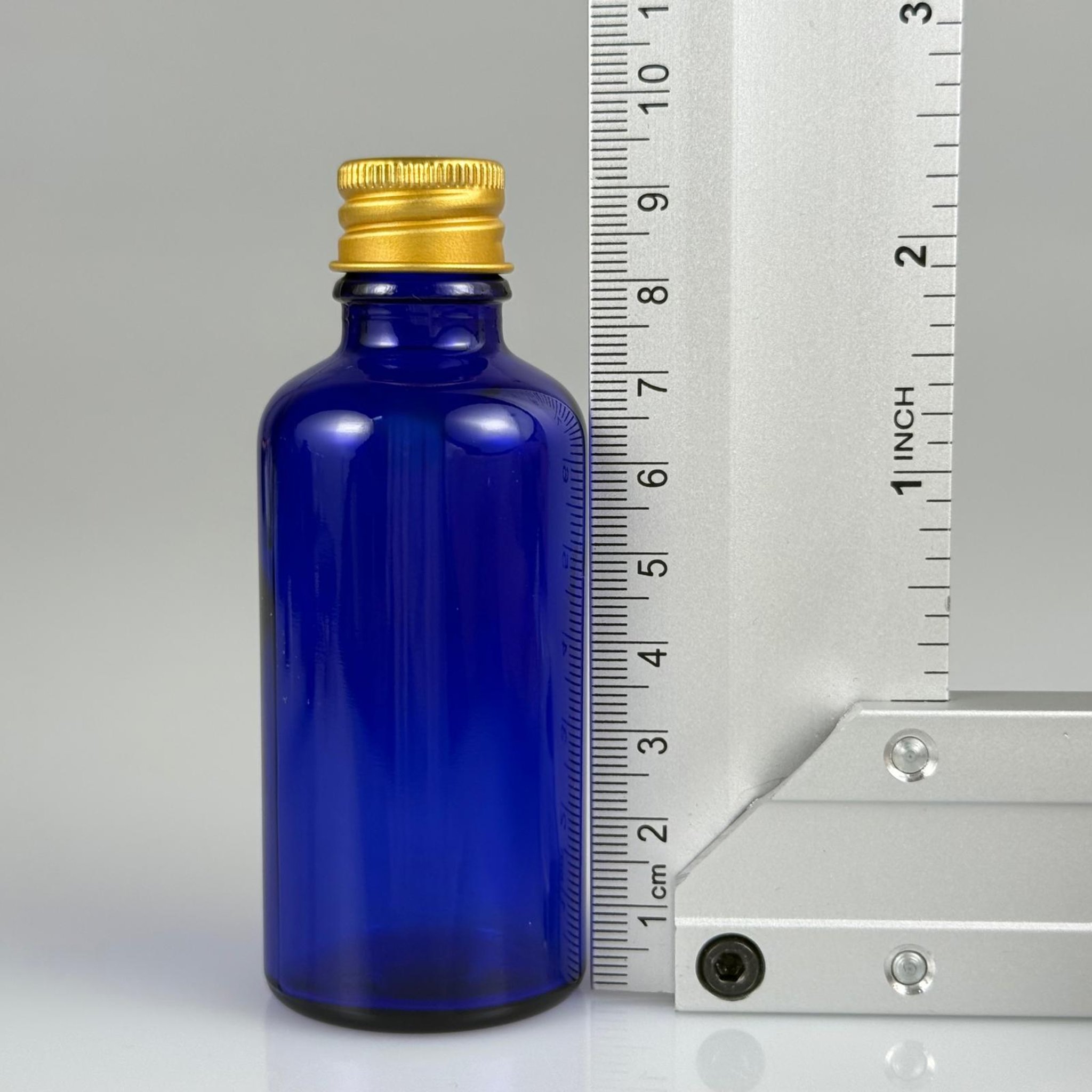50 CC MAVİ CAM ŞİŞE + KÖPÜK CONTALI GOLD ALÜMİNYUM METAL KAPAKLI + DAMLALIKLI KOLONYA TIPALI TAKIM - 50 ML MAVİ CAM ŞİŞE
