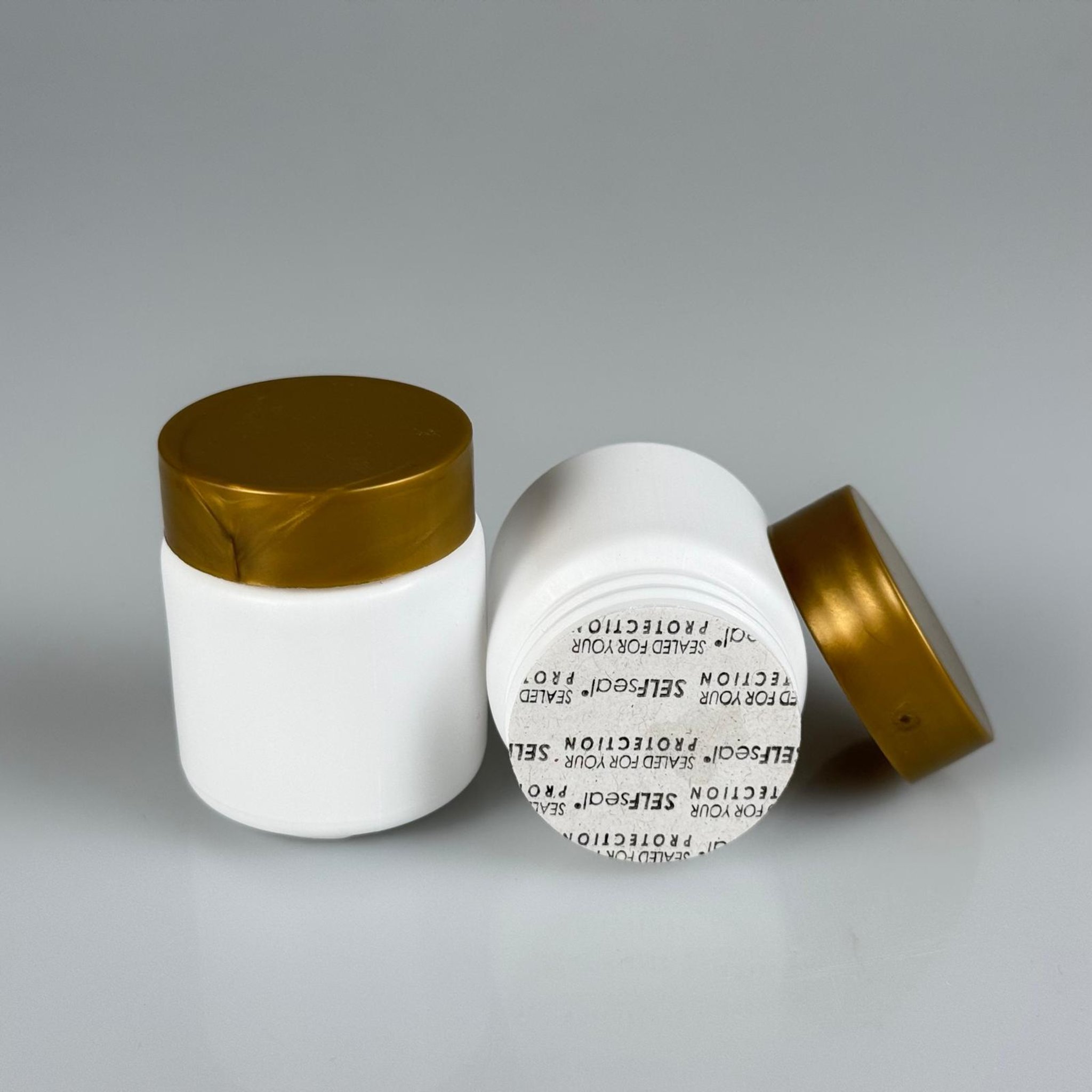 50 CC BEYAZ SERT POLİETİLEN ŞİŞE + GOLD PLASTİK KAPAKLI + KENDİNDEN YAPIŞKANLI KÖPÜK CONTALI - 50 ML POLİETİLEN ŞİŞE