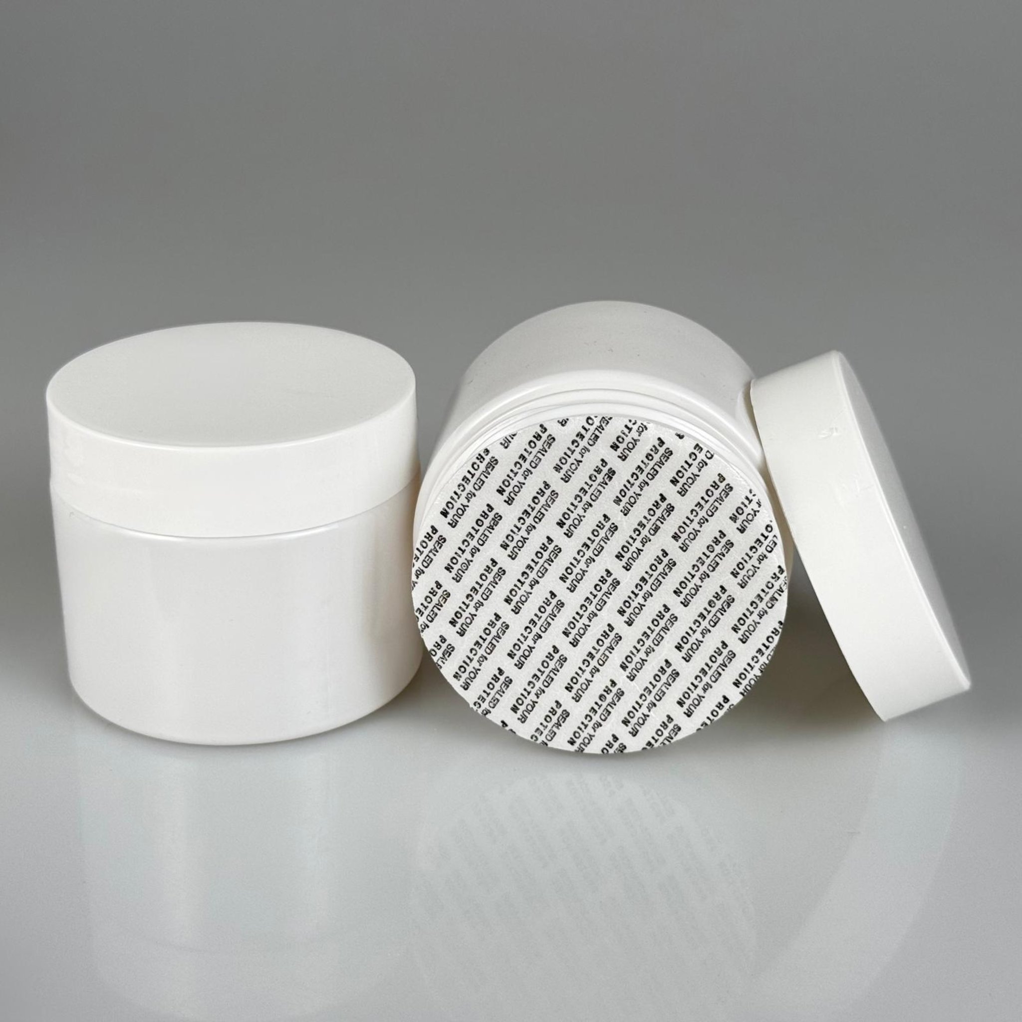 100 CC BEYAZ PET KAVANOZ + BEYAZ PLASTİK KAPAKLI + KENDİNDEN YAPIŞKANLI KÖPÜK CONTALI TAKIM - 100 ML PLASTİK KREM KAVANOZU