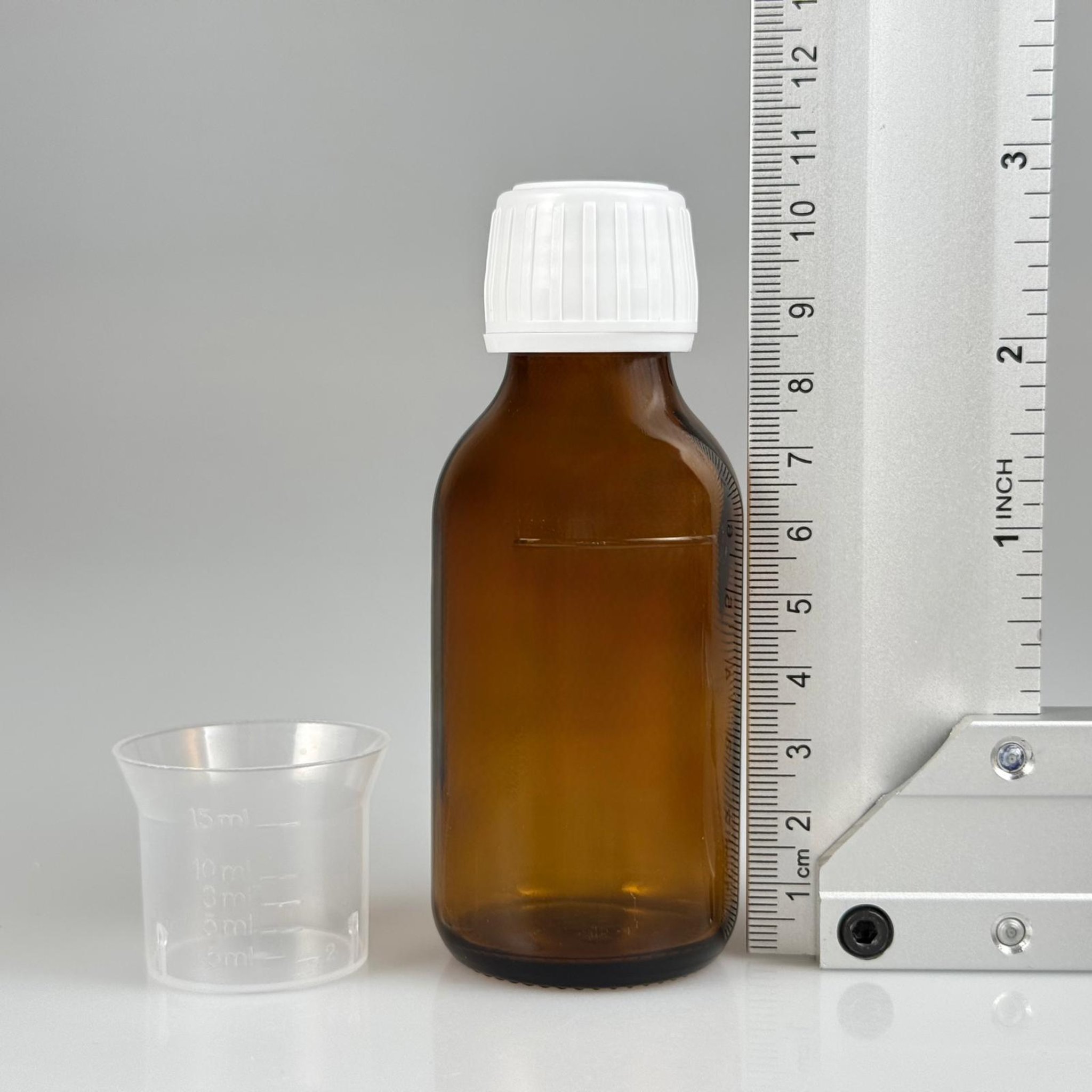 75 CC AMBER ECZA ŞİŞESİ + BEYAZ KİLİTLİ KAPAKLI + 15 ML ÖLÇEKLİ TAKIM - 75 AĞIZ KAHVERENGİ ŞURUP ŞİŞESİ
