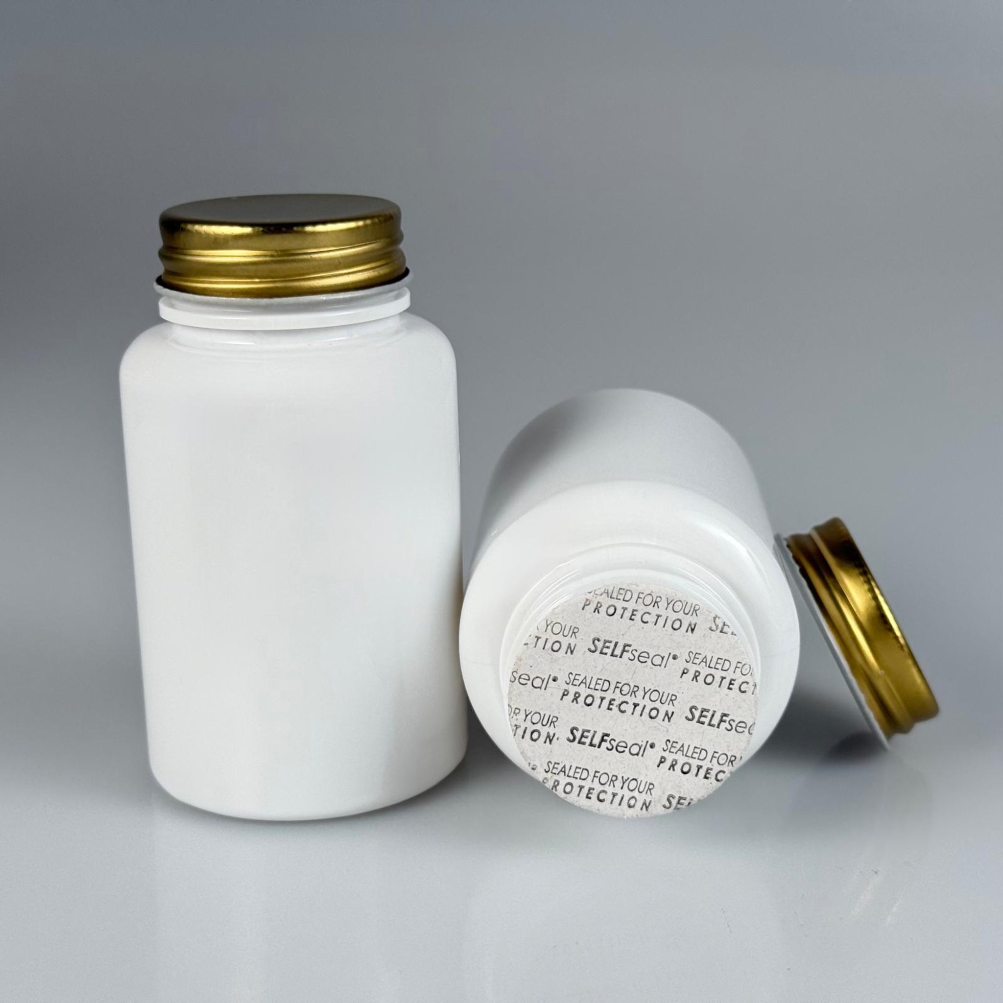 150 CC BEYAZ PET TABLET ŞİŞESİ - GOLD METAL KAPAKLI + KENDİNDEN YAPIŞKANLI KÖPÜK CONTALI - 150 ML KAPSÜL KUTUSU - İLAÇ ŞİŞESİ - MEDİKAL HAP ŞİŞESİ - FARMASÖTİK KAVANOZ