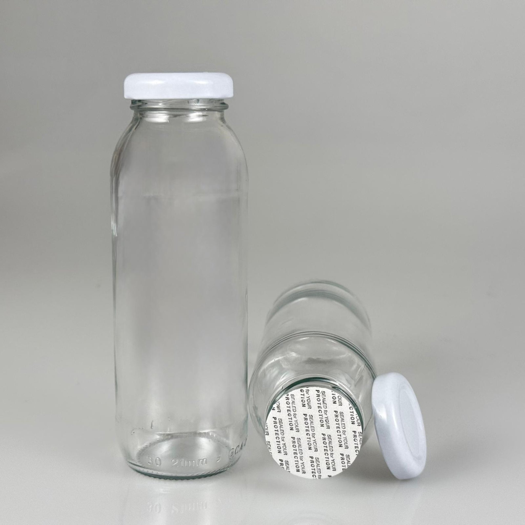 250 CC CAM KONSERVE ŞİŞESİ - BEYAZ METAL KAPAKLI + KENDİNDEN YAPIŞKANLI SIZDIRMAZ CONTALI TAKIM - 250 ML CAM MEYVE SUYU ŞİŞESİ - ŞİŞECAM KODU 412825 İLE EŞDEĞERDİR.