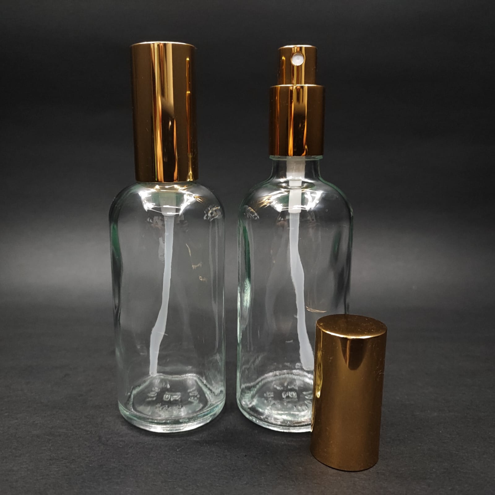 100 ML LÜKS VİDALI VALF ÇEVİRME PARFÜM ŞİŞELERİ - 100 CC ŞEFFAF CAM ŞİŞE - GOLD METAL SPREYLİ KAPAKLI SET