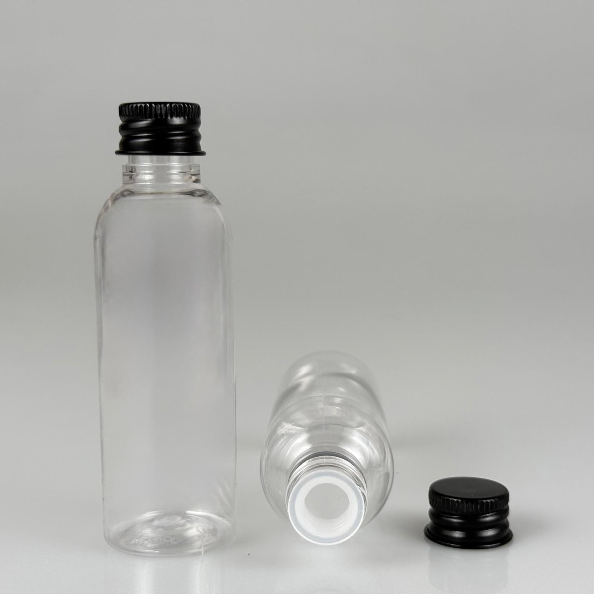50 CC ŞEFFAF SİLİNDİR UZUN MODEL PET ŞİŞE + KÖPÜK CONTALI SİYAH ALÜMİNYUM METAL KAPAKLI + KÖR TIPALI TAKIM - 50 ML PLASTİK ŞİŞE