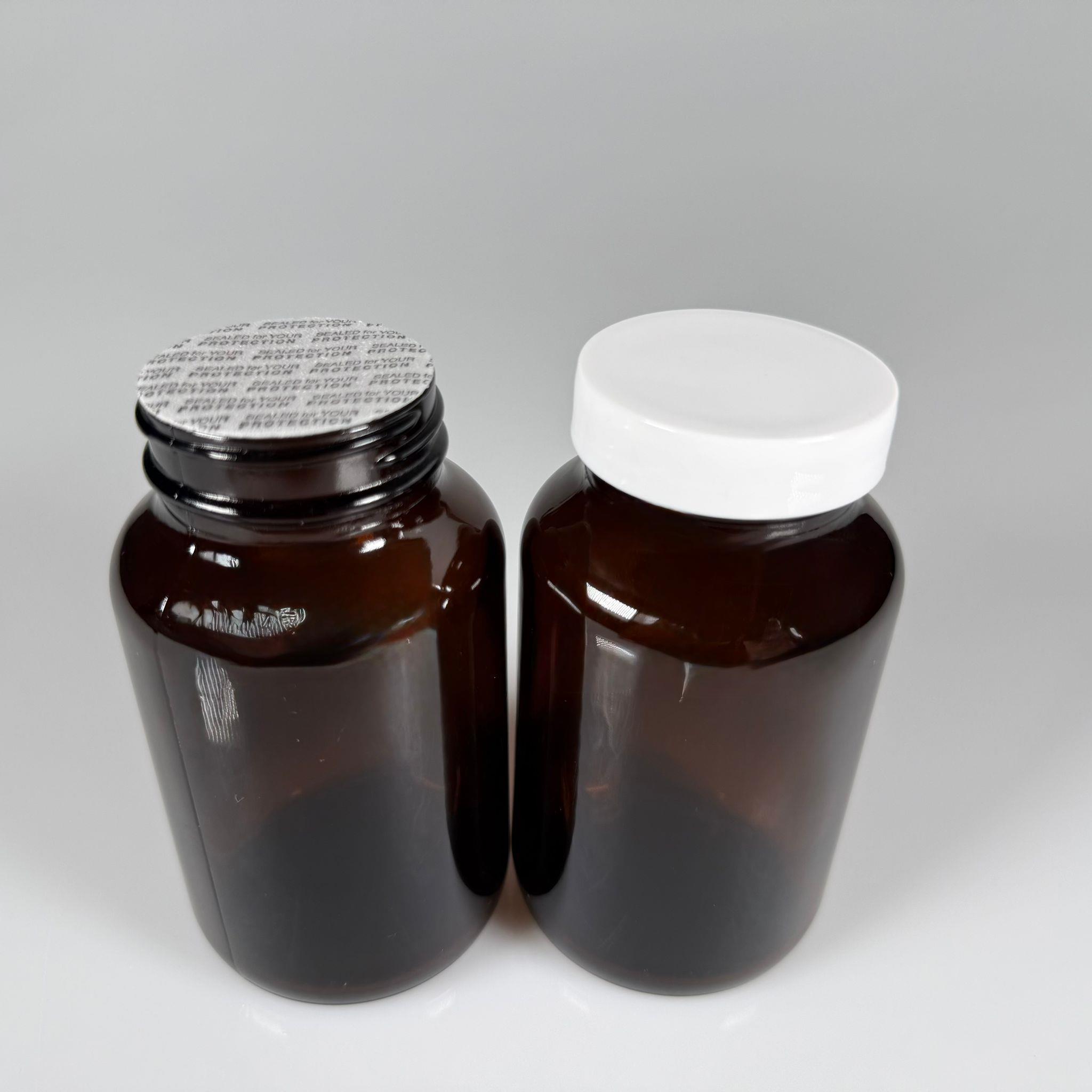 200 CC CAM KAHVERENGİ AMBER TABLET KAPSÜL ŞİŞESİ + 45 MM VİDALI BEYAZ PLASTİK KAPAK + KENDİNDEN YAPIŞKANLI KÖPÜK CONTA