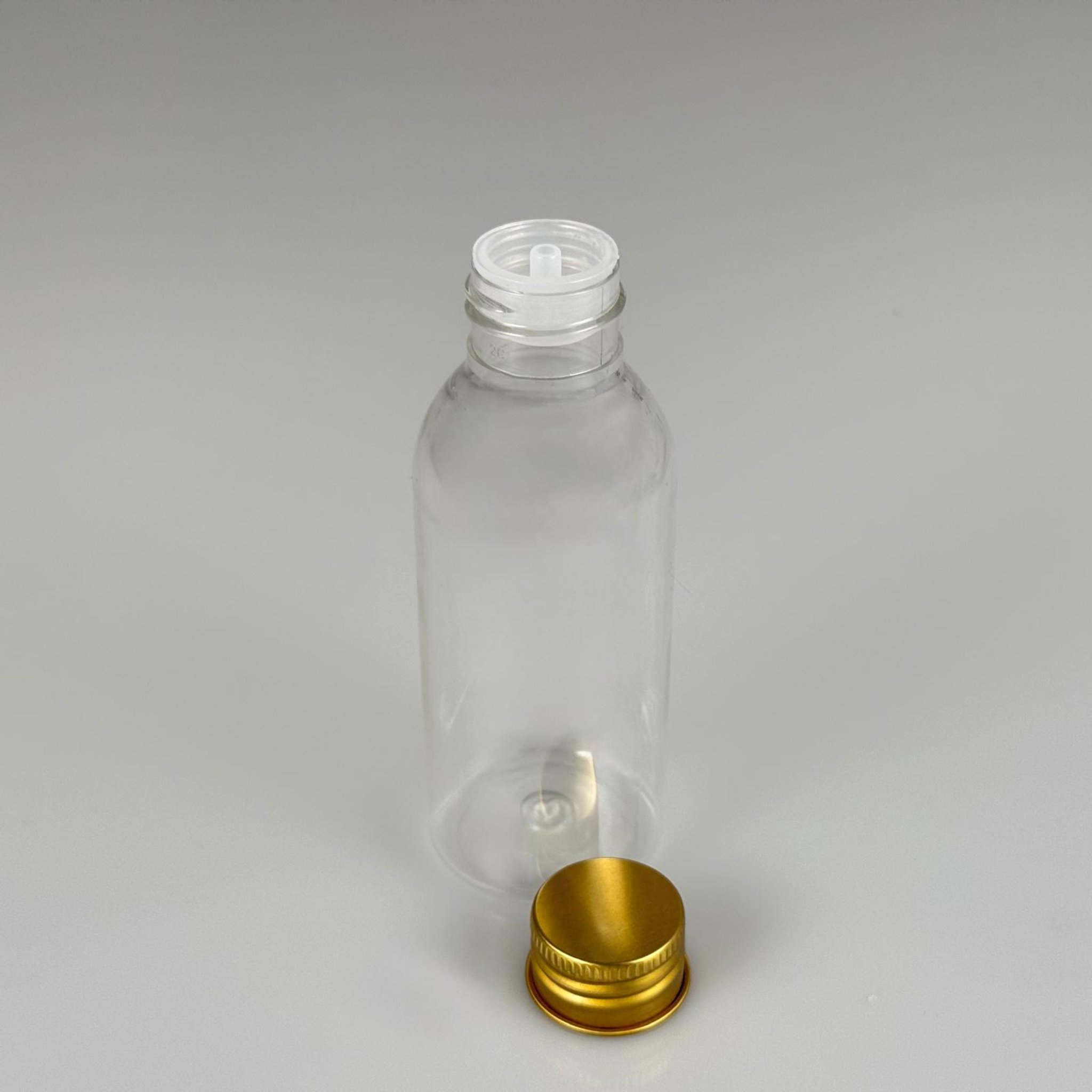100 CC SİLİNDİR OVAL MODEL ŞEFFAF SERT PET ŞİŞE (24 AĞIZ) + KÖPÜK CONTALI GOLD METAL ALÜMİNYUM KAPAK + KOLONYA TIPALI TAKIM - 100 ML KAPAKLI KALIN PLASTİK ŞEFFAF ŞİŞELER