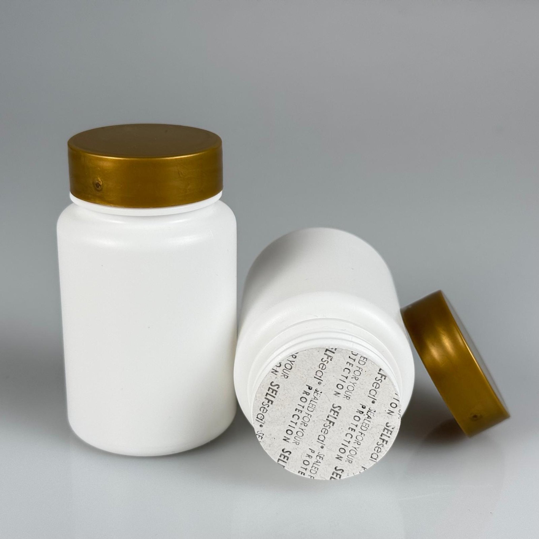 100 CC BEYAZ SERT POLİETİLEN ŞİŞE + GOLD PLASTİK KAPAKLI + KENDİNDEN YAPIŞKANLI KÖPÜK CONTALI - 100 ML POLİETİLEN ŞİŞE