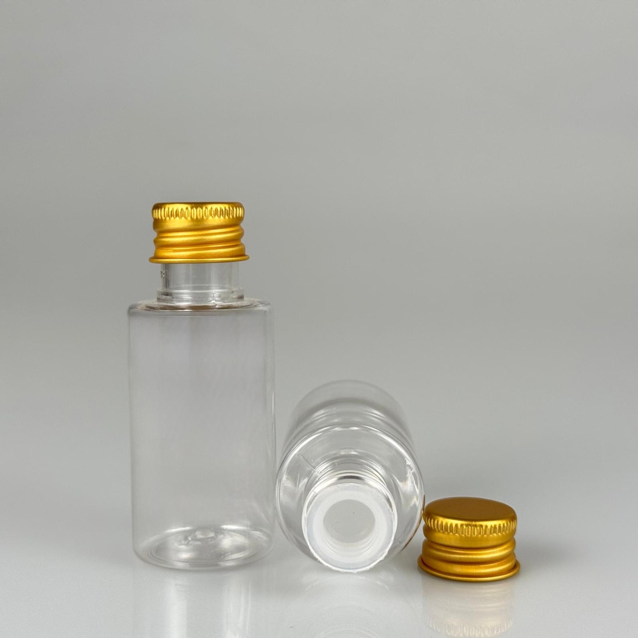 30 CC SİLİNDİR KISA MODEL PET ŞİŞE - KÖPÜK CONTALI GOLD ALÜMİNYUM METAL KAPAKLI + KÖR TIPALII TAKIM - 30 ML ŞEFFAF PET ŞİŞE