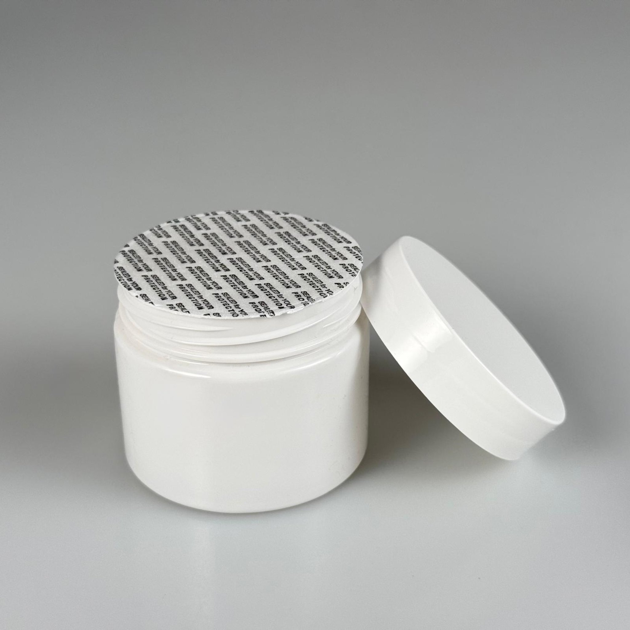 100 CC BEYAZ PET KAVANOZ + BEYAZ PLASTİK KAPAKLI + KENDİNDEN YAPIŞKANLI KÖPÜK CONTALI TAKIM - 100 ML PLASTİK KREM KAVANOZU
