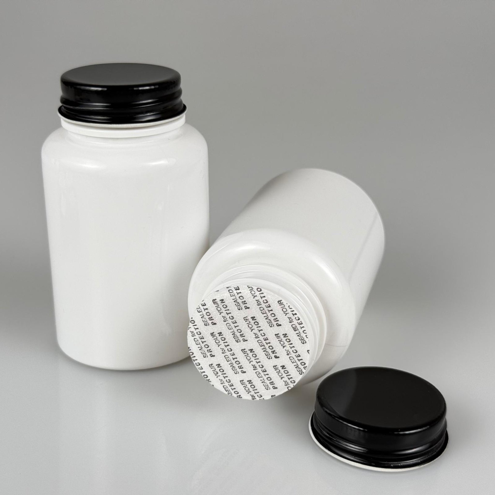 150 CC BEYAZ PET TABLET ŞİŞESİ - SİYAH METAL KAPAKLI + KENDİNDEN YAPIŞKANLI KÖPÜK CONTALI - 150 ML KAPSÜL KUTUSU - İLAÇ ŞİŞESİ - MEDİKAL HAP ŞİŞESİ - FARMASÖTİK KAVANOZ