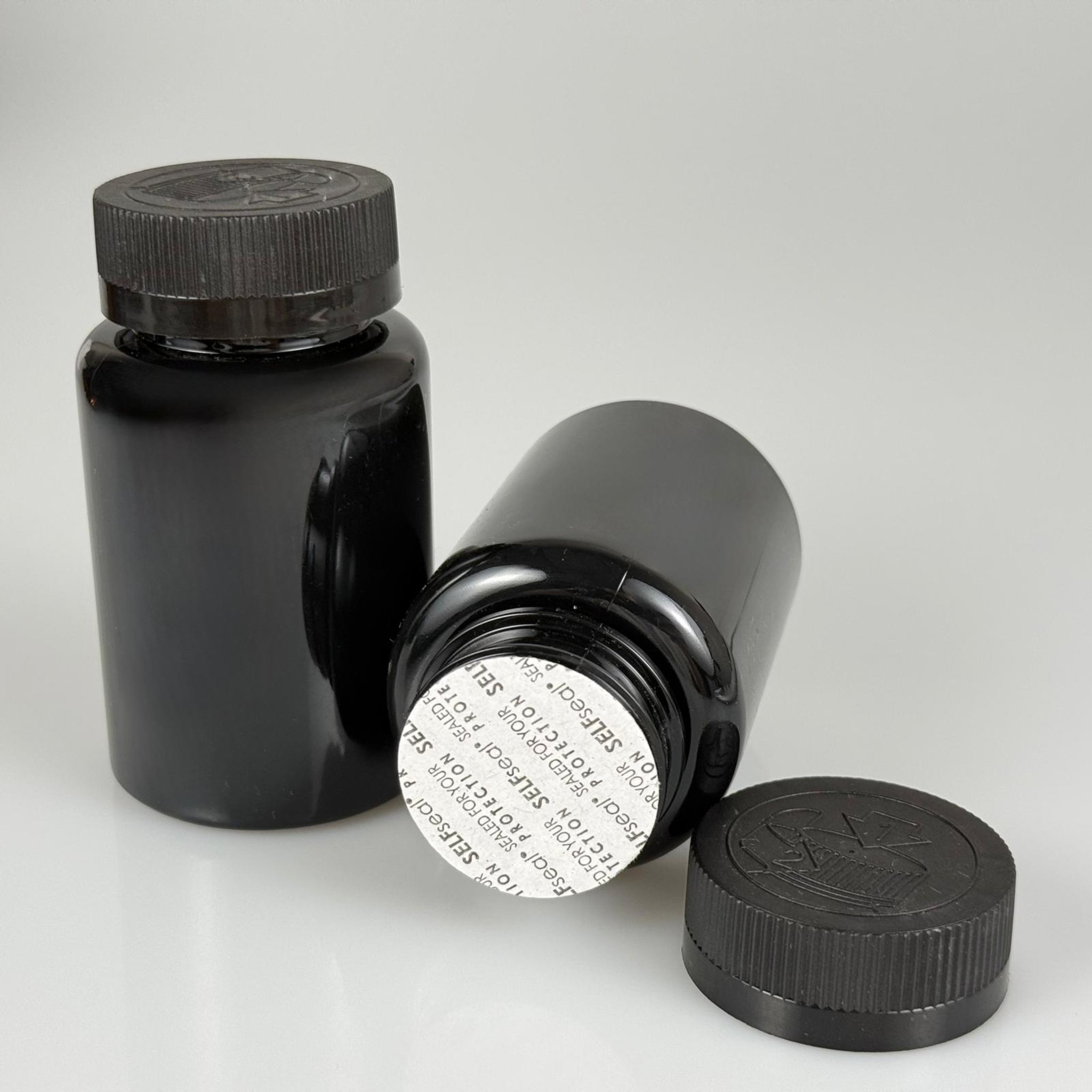 150 ML CONTALI ÇOCUK KİLİT KAPAKLI TABLET ŞİŞESİ  - 150 CC SİYAH PET KAVANOZ + 38 MM SİYAH ÇOCUK KİLİTLİ KAPAK + KENDİNDEN YAPIŞKANLI KÖPÜK CONTA TAKIM -  KAPSÜL KUTUSU - İLAÇ ŞİŞESİ - MEDİKAL HAP ŞİŞESİ - FARMASÖTİK KAVANOZ
