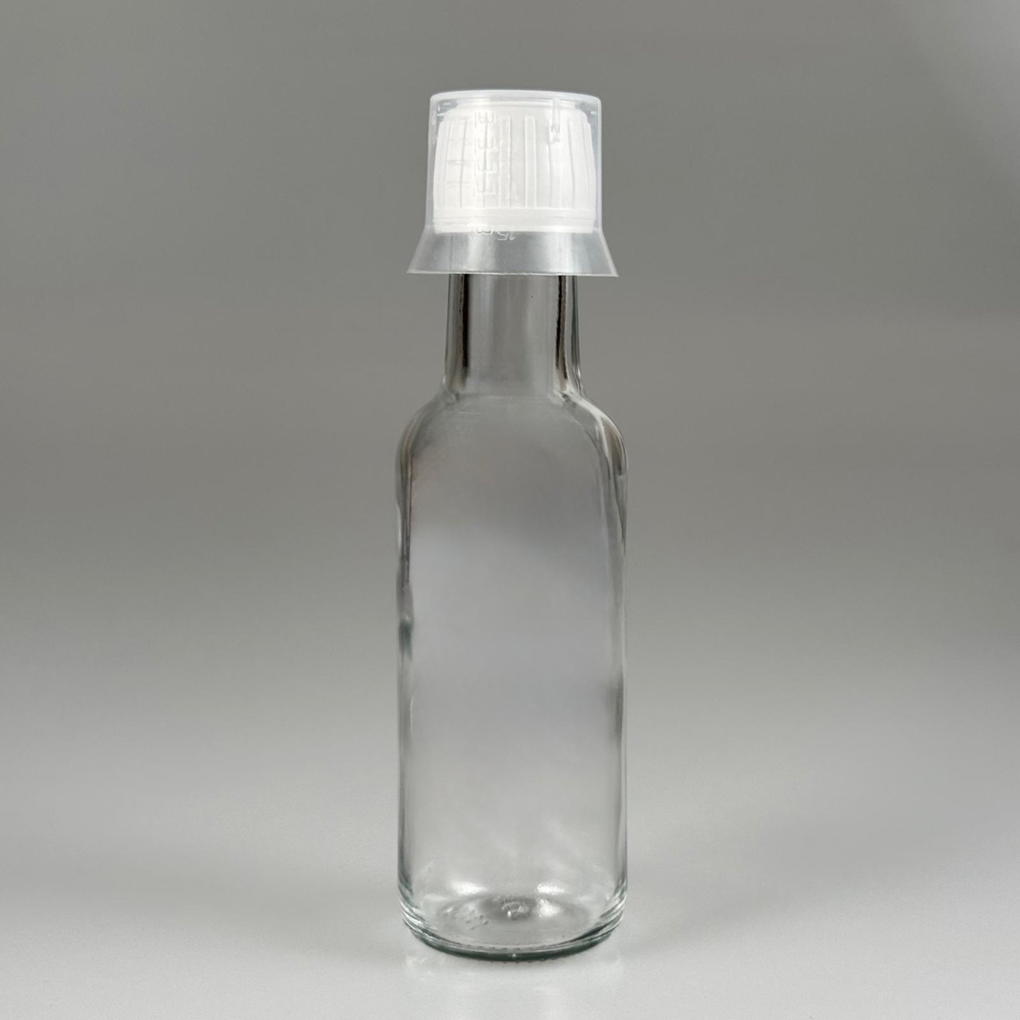 100 CC DORİKA CAM ŞİŞE + BEYAZ KİLİTLİ KAPAK+ 15 ML ÖLÇEK TAKIM - 100 ML ŞEFFAF CAM DORİKA ŞİŞE