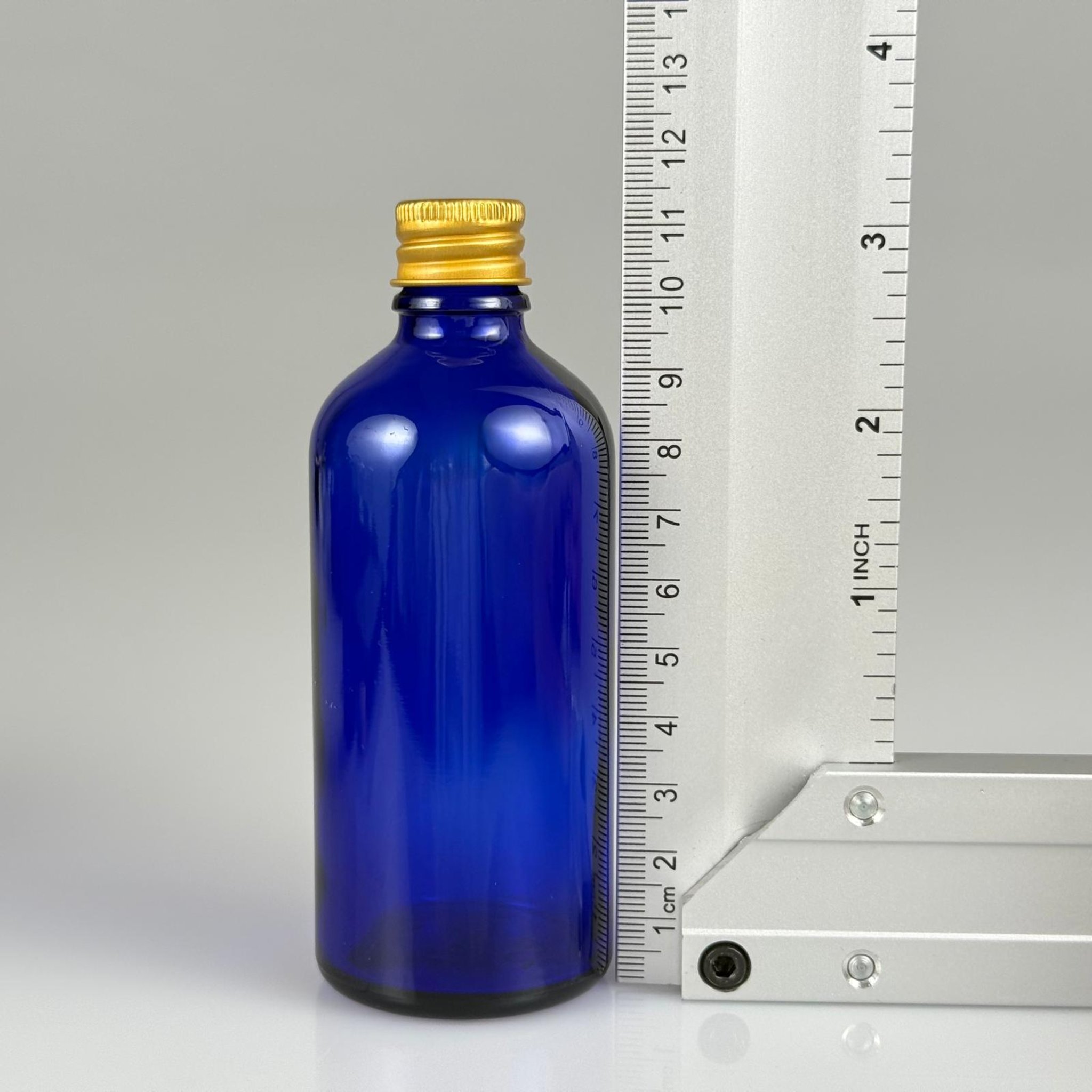 100 CC MAVİ CAM ŞİŞE + KÖPÜK CONTALI GOLD ALÜMİNYUM METAL + KÖR TIPALI KAPAKLI TAKIM - 100 ML MAVİ CAM ŞİŞE