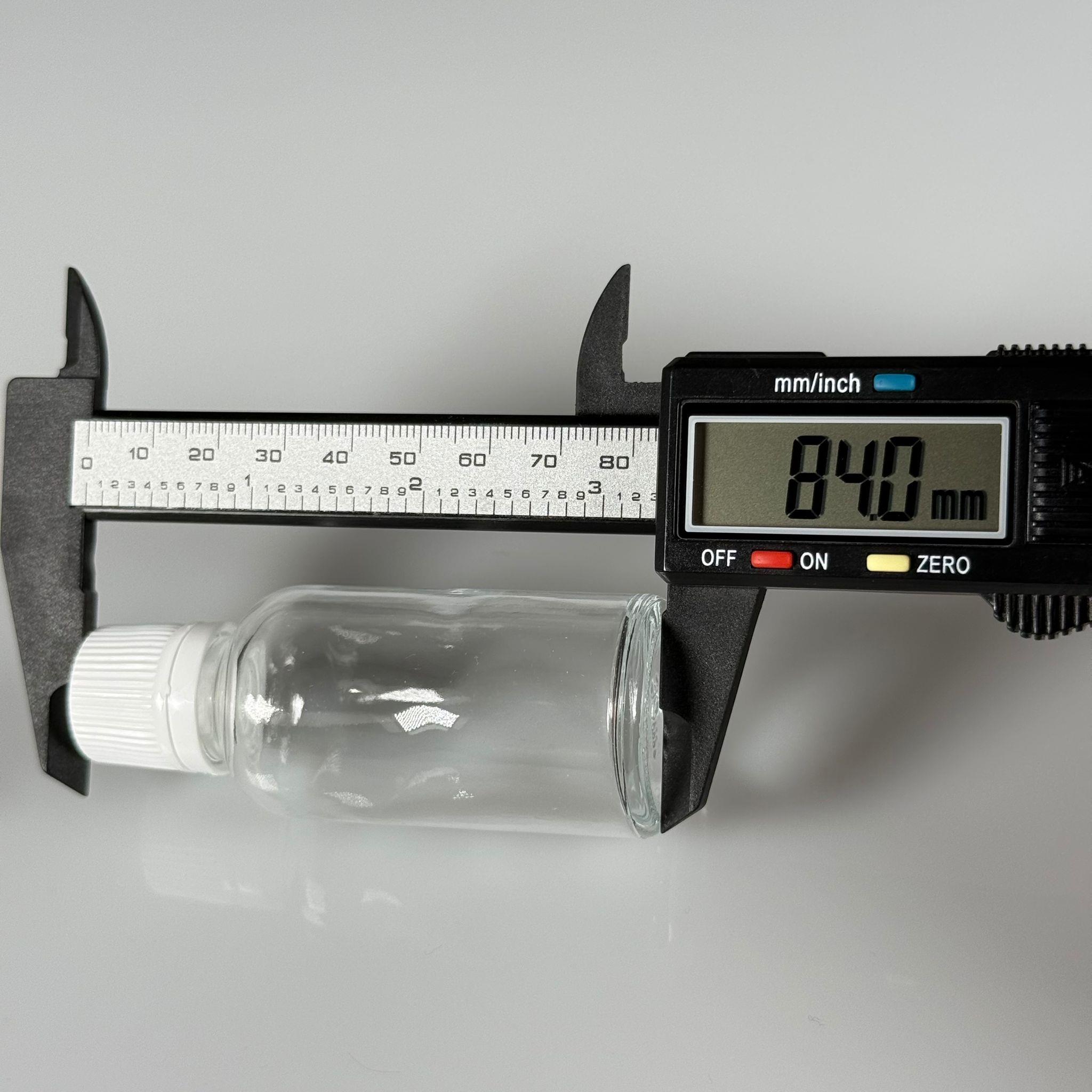30 CC CAM ŞEFFAF KİLİTLİ, KENDİNDEN CONTALI BEYAZ KAPAKLI - 30 ML DAR AĞIZLI İLAÇ ŞİŞESİ