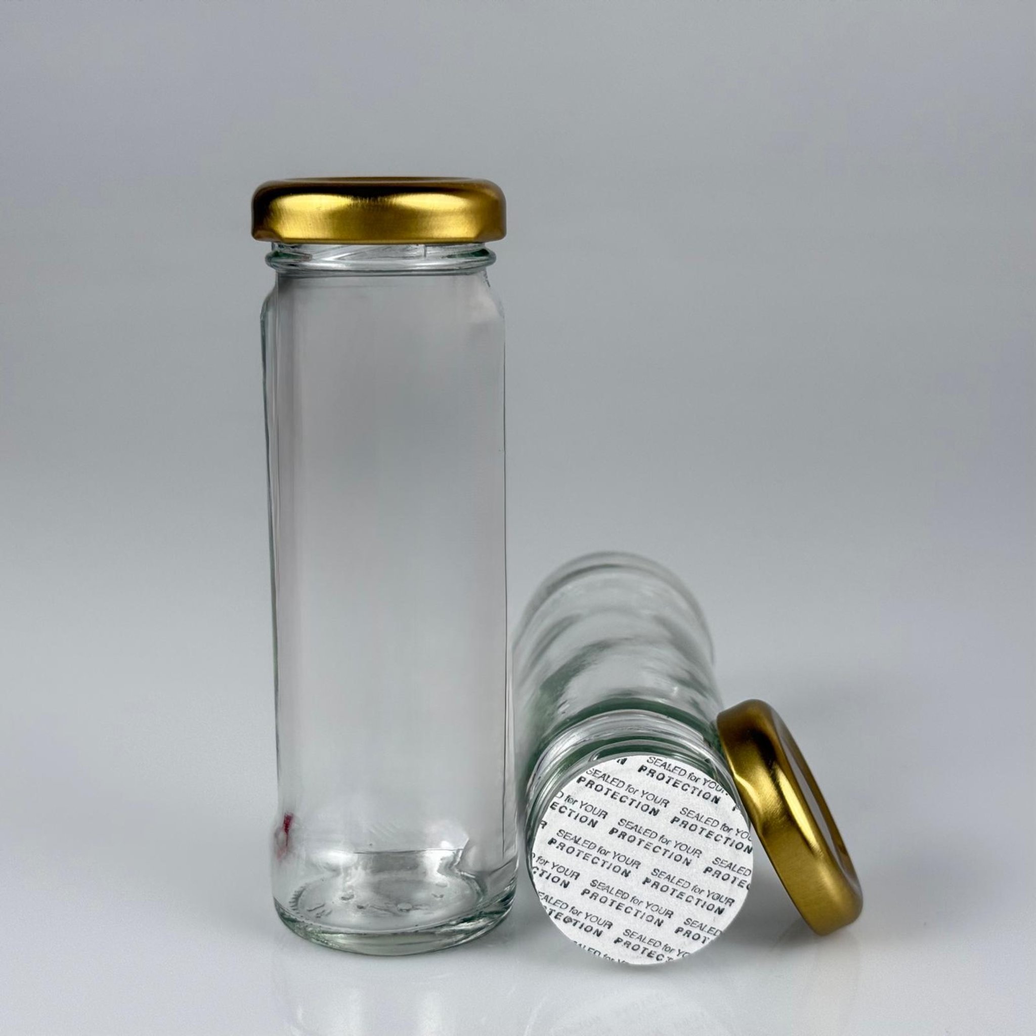 105 CC UZUN CAM KAVANOZ - GOLD METAL KAPAKLI + KENDİNDEN YAPIŞKANLI SIZDIRMAZ CONTALI TAKIM - 105 ML SİLİNDİR BORU KAVANOZ (ŞİŞECAM KODU 140111)