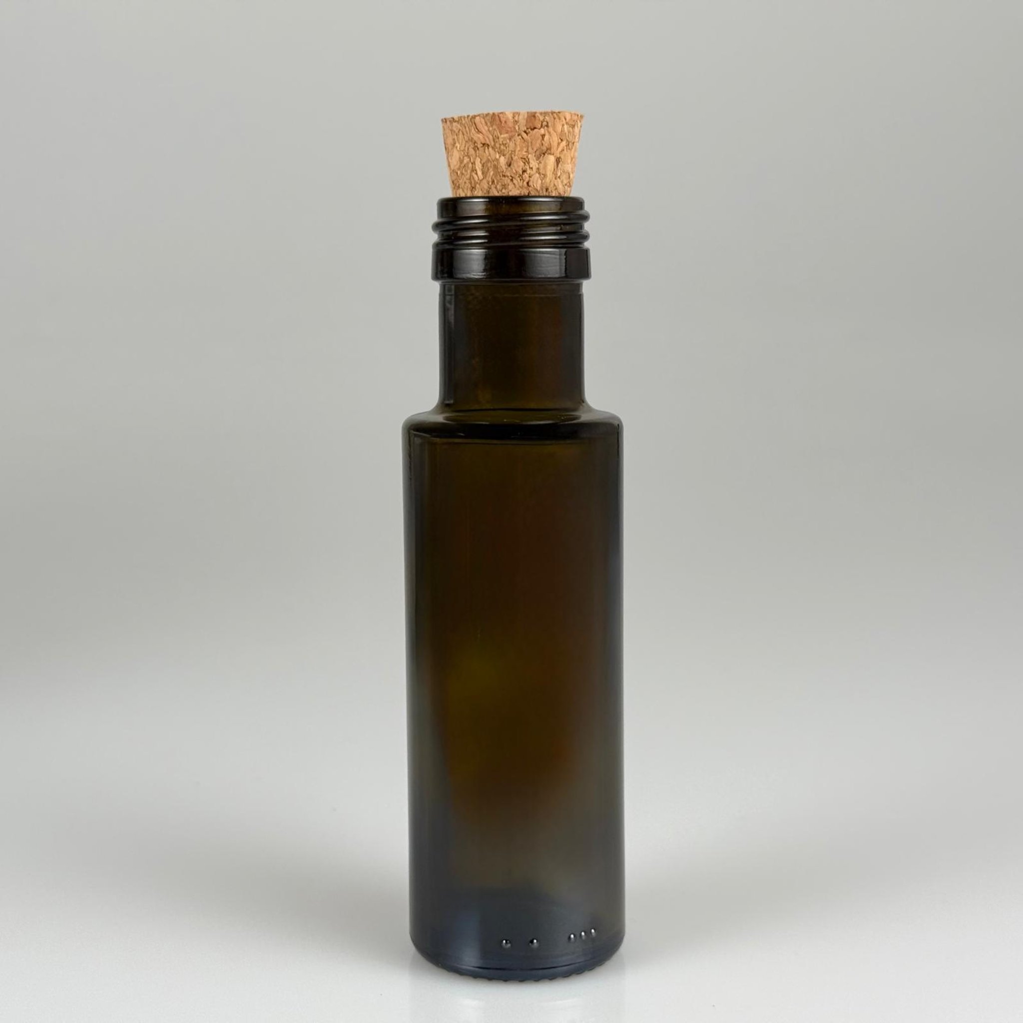 100 CC DORİKA CAM ŞİŞE KOYU YEŞİL (31 MM AĞIZ) - MANTAR TIPALI - 100 ML SİLİNDİR DORİCA YAĞ VE SOS ŞİŞELERİ