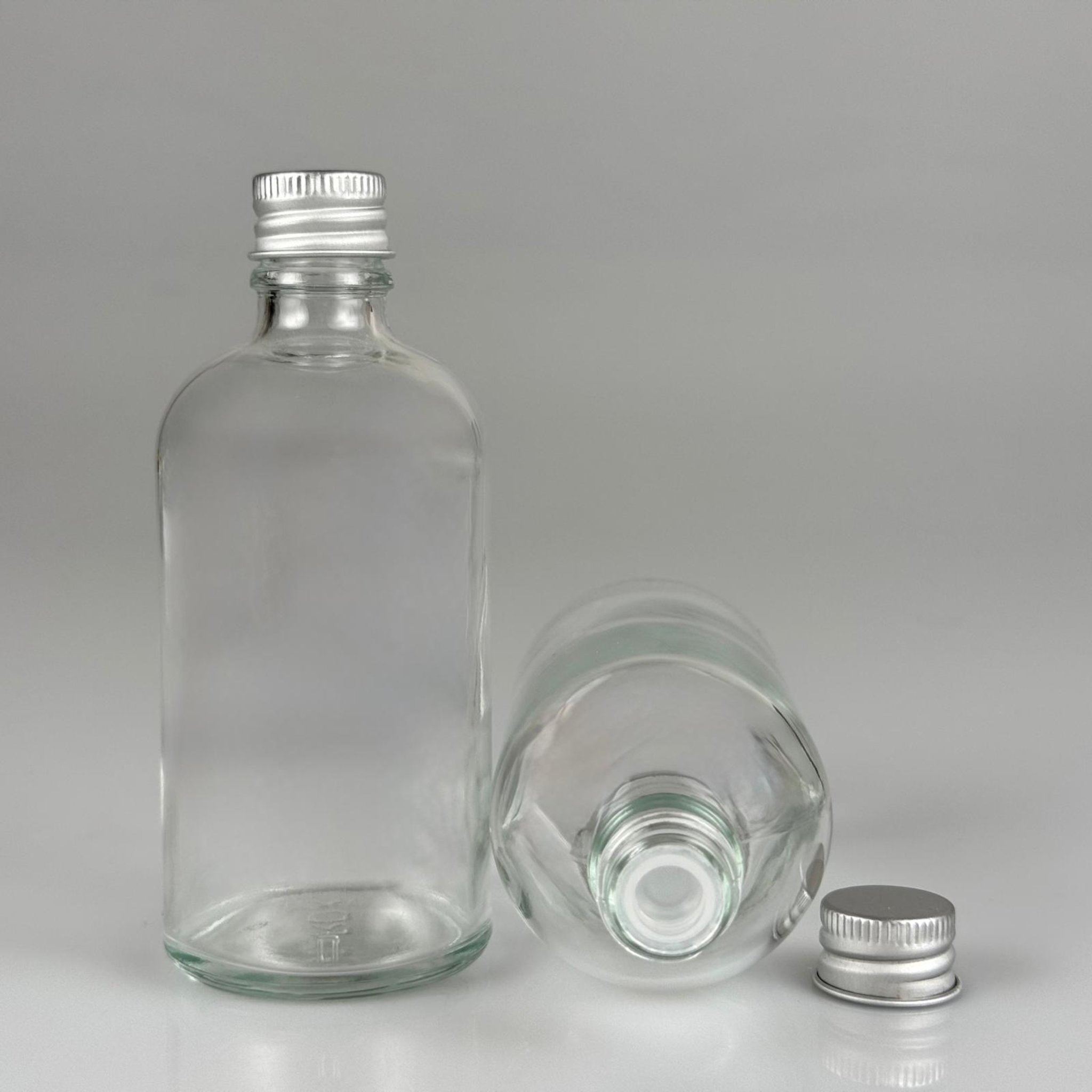 100 CC ŞEFFAF CAM ŞİŞE + KÖPÜK CONTALI GÜMÜŞ ALÜMİNYUM METAL KAPAKLI + KÖR TIPALI TAKIM - 100 ML ŞEFFAF CAM ŞİŞE