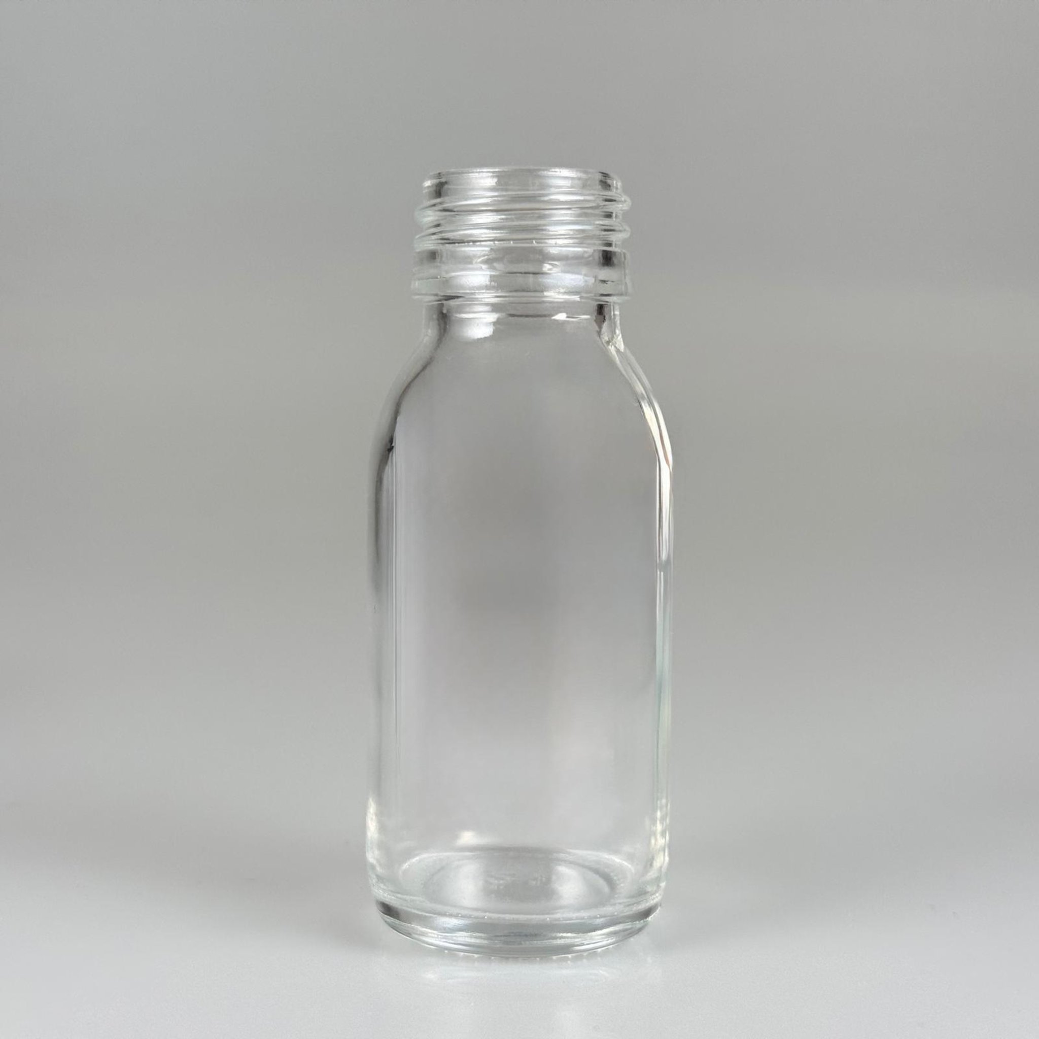60 CC GENİŞ AĞIZLI ŞEFFAF CAM ŞİŞE KAPAKSIZ (28 AĞIZ) - 60 ML ŞEFFAF ŞURUP ECZA ŞİŞESİ - MİKROPLARDAN KORUNMASI İÇİN İLAÇLANMIŞTIR, SUYA TUTUNCA ŞEFFAF RENGİ ALIR