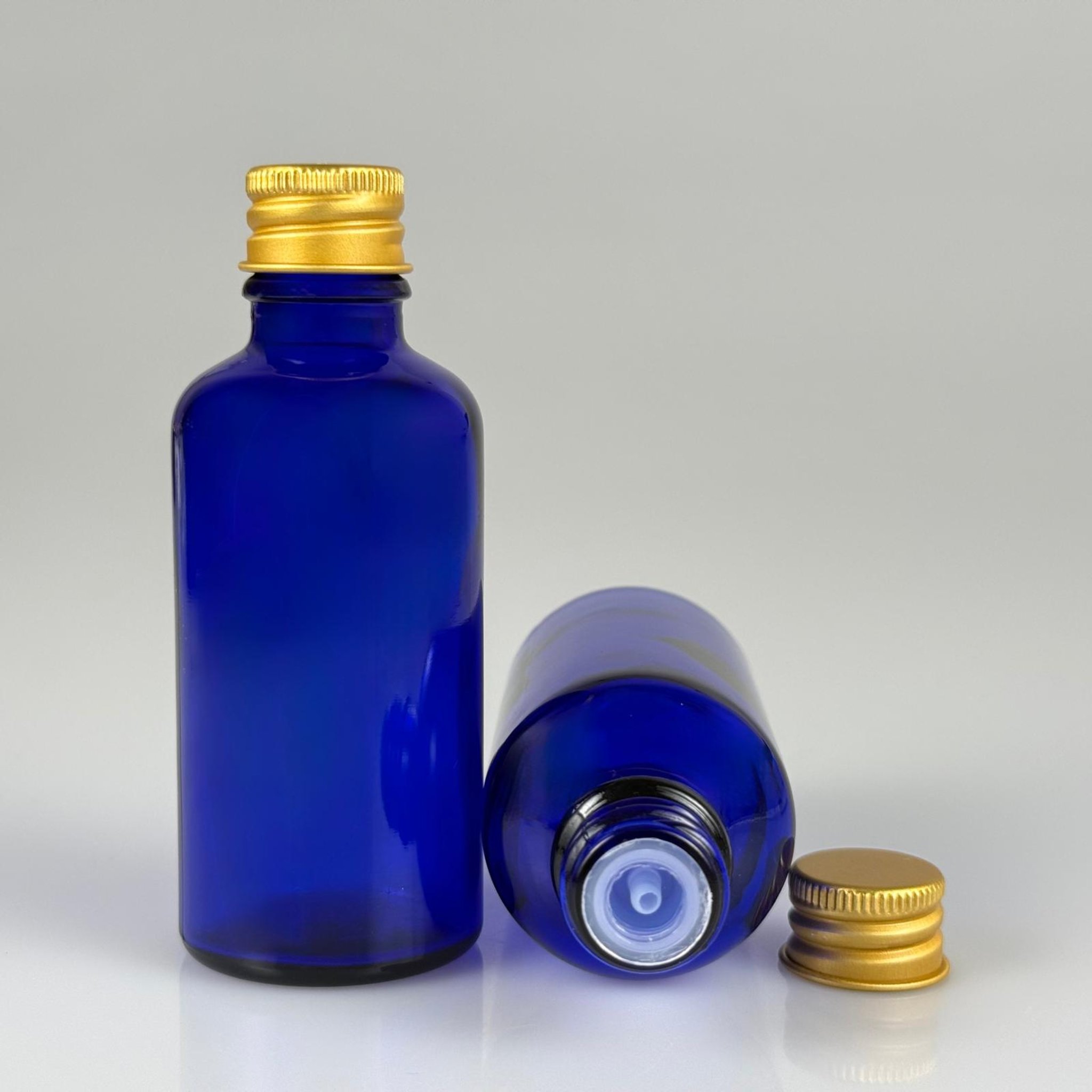 50 CC MAVİ CAM ŞİŞE + KÖPÜK CONTALI GOLD ALÜMİNYUM METAL KAPAKLI + DAMLALIKLI KOLONYA TIPALI TAKIM - 50 ML MAVİ CAM ŞİŞE