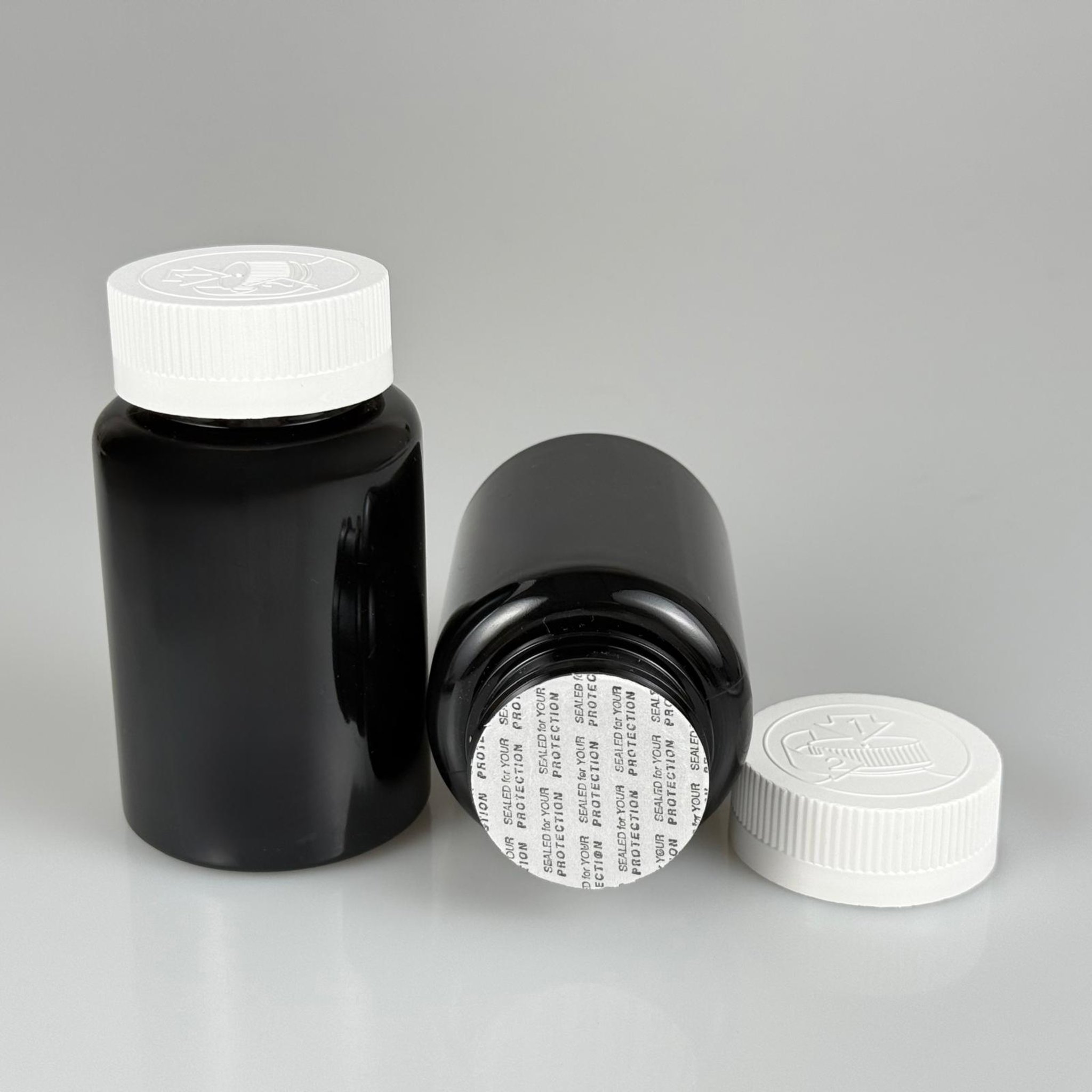 150 ML CONTALI ÇOCUK KİLİT KAPAKLI TABLET ŞİŞESİ  - 150 CC SİYAH PET KAVANOZ + 38 MM BEYAZ ÇOCUK KİLİTLİ KAPAK + KENDİNDEN YAPIŞKANLI KÖPÜK CONTA TAKIM -  KAPSÜL KUTUSU - İLAÇ ŞİŞESİ - MEDİKAL HAP ŞİŞESİ - FARMASÖTİK KAVANOZ