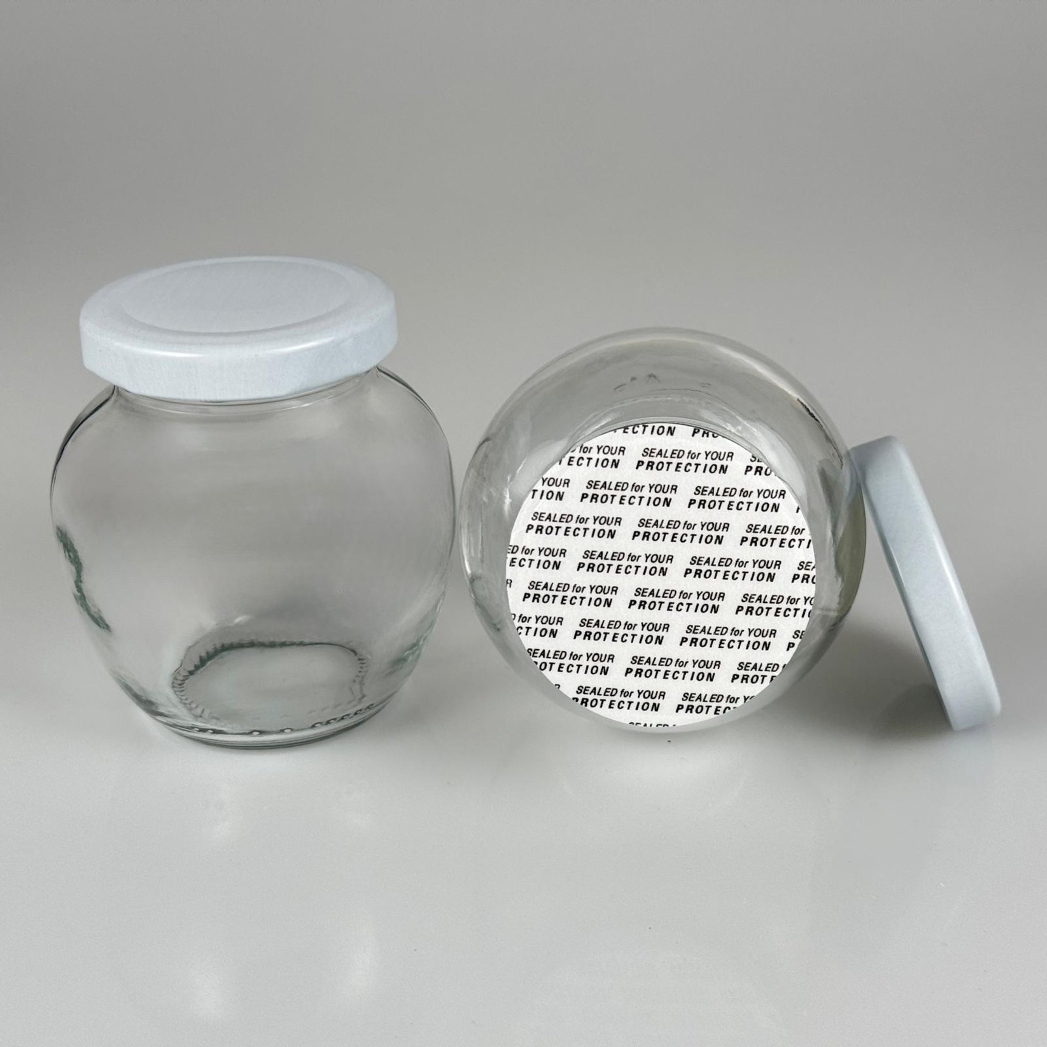 210 CC YUMURTA KAVANOZ + BEYAZ METAL KAPAKLI + KENDİNDEN YAPIŞKANLI KÖPÜK CONTALI TAKIM - 210 ML OVAL TİP CAM KAVANOZ