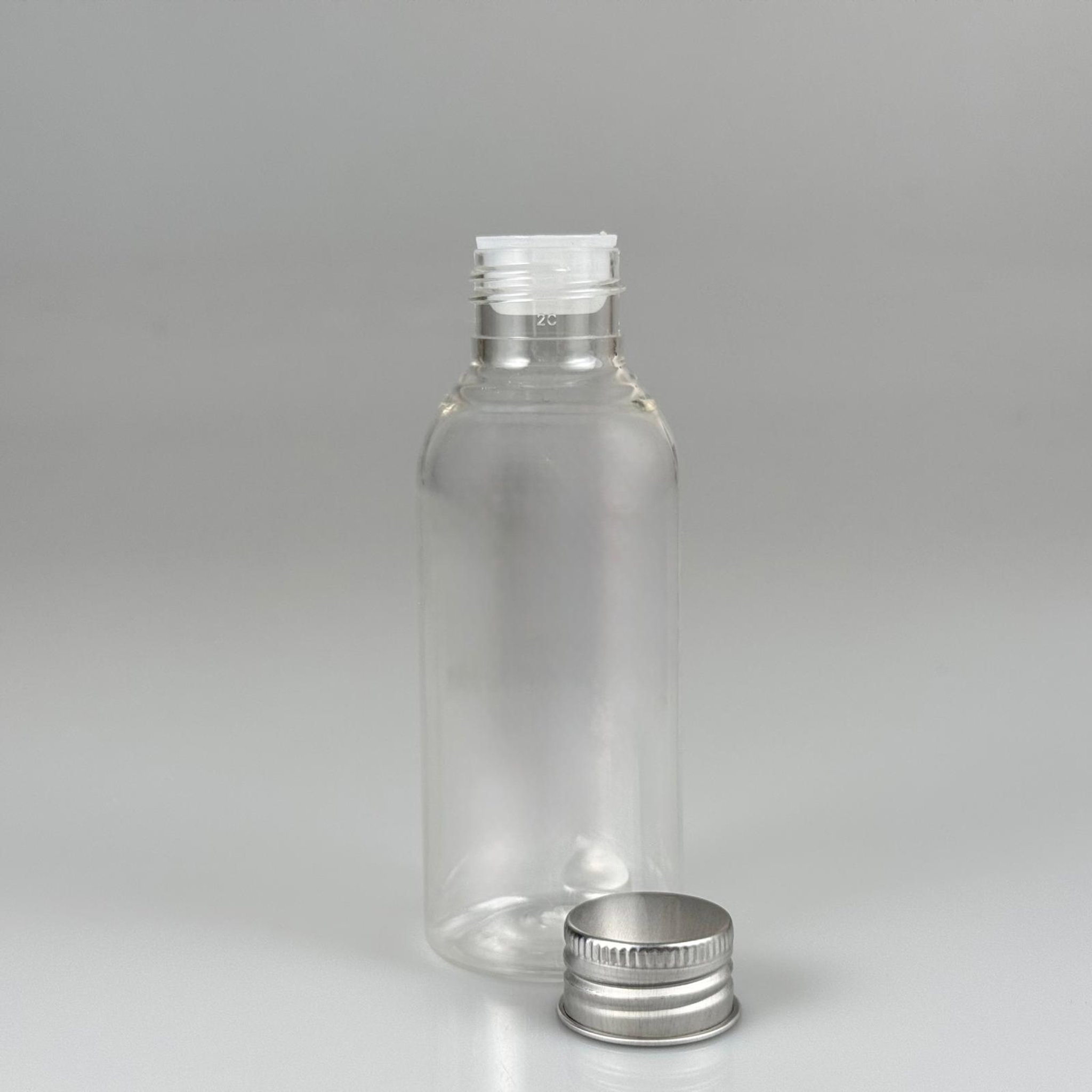 100 CC SİLİNDİR OVAL MODEL ŞEFFAF SERT PET ŞİŞE (24 AĞIZ) + KÖPÜK CONTALI GÜMÜŞ METAL ALÜMİNYUM KAPAK + KOLONYA TIPALI TAKIM - 100 ML KAPAKLI KALIN PLASTİK ŞEFFAF ŞİŞELER
